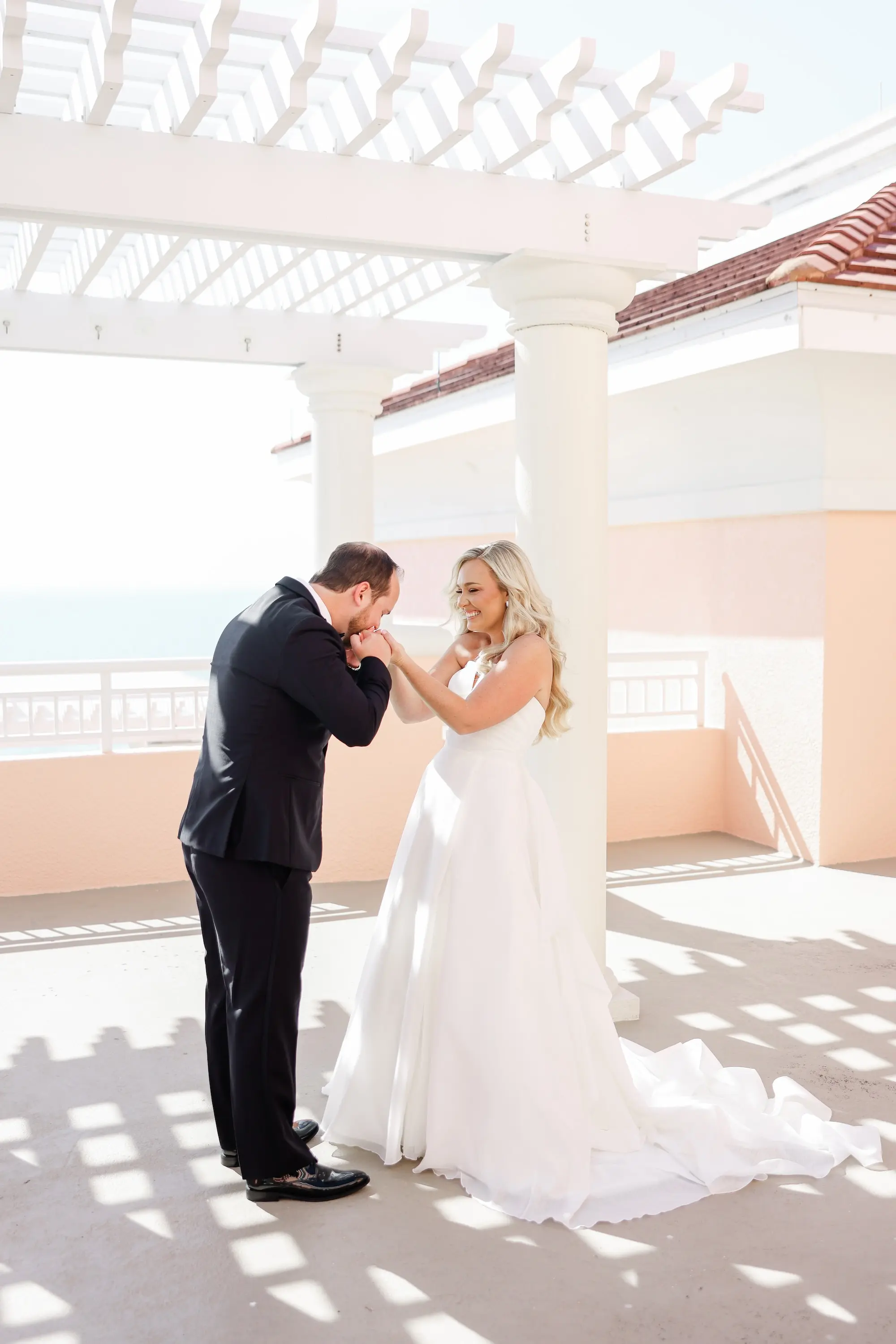 13Classic White Florida Wedding Ideas - Classic, White Rooftop Wedding | Hyatt Regency Clearwater Beach Bride and Groom First Look Wedding Portrait | Balcony Oceanview of Venue Hyatt Regency Clearwater Beach Resort and Spa | Tampa Bay Photographer Lifelong Photography Studio