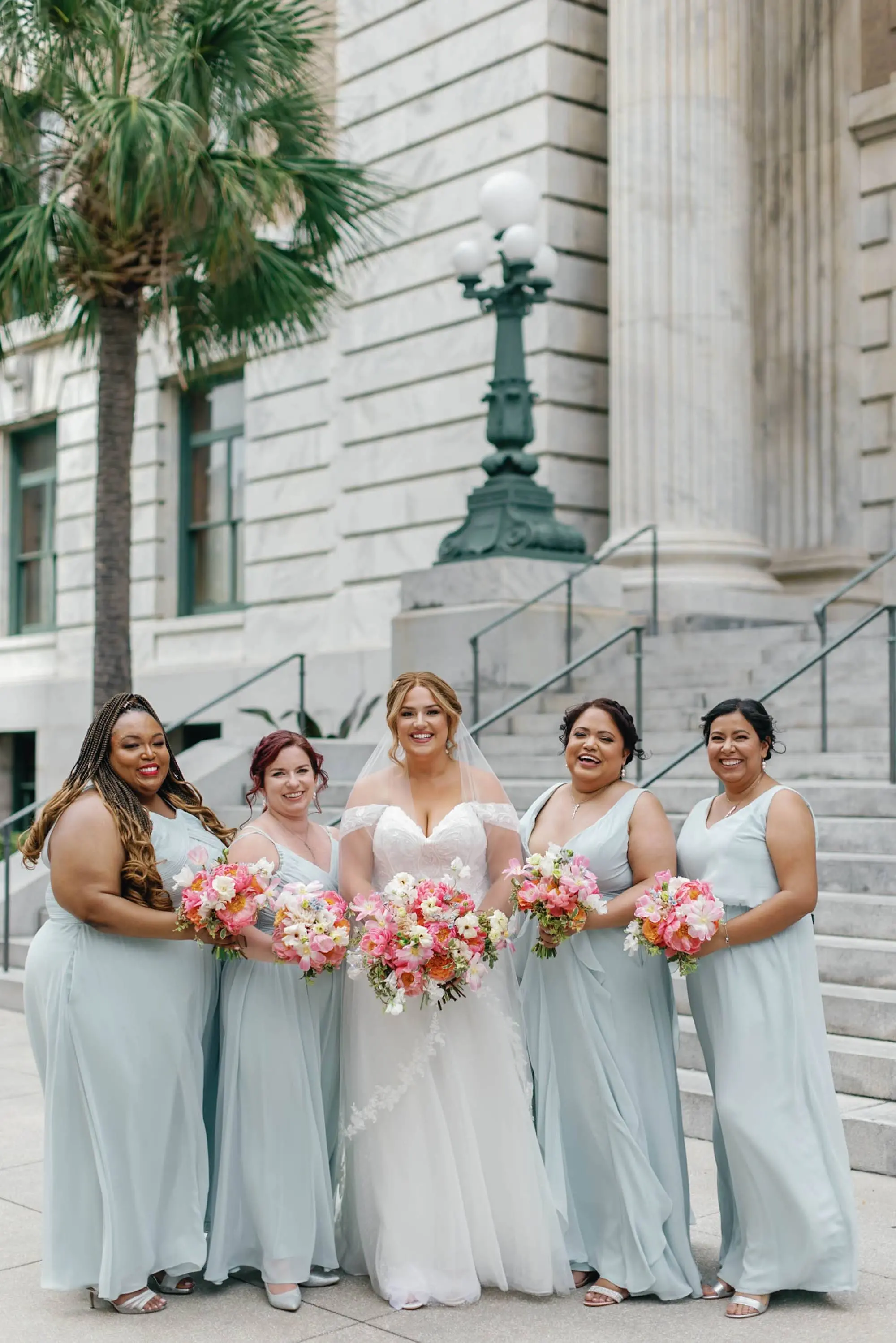 Bride and Bridesmaids Wedding Portrait | Mismatching Sky Blue Bridesmaids Dress Ideas | Tampa Bay Florist Monarch Events and Design