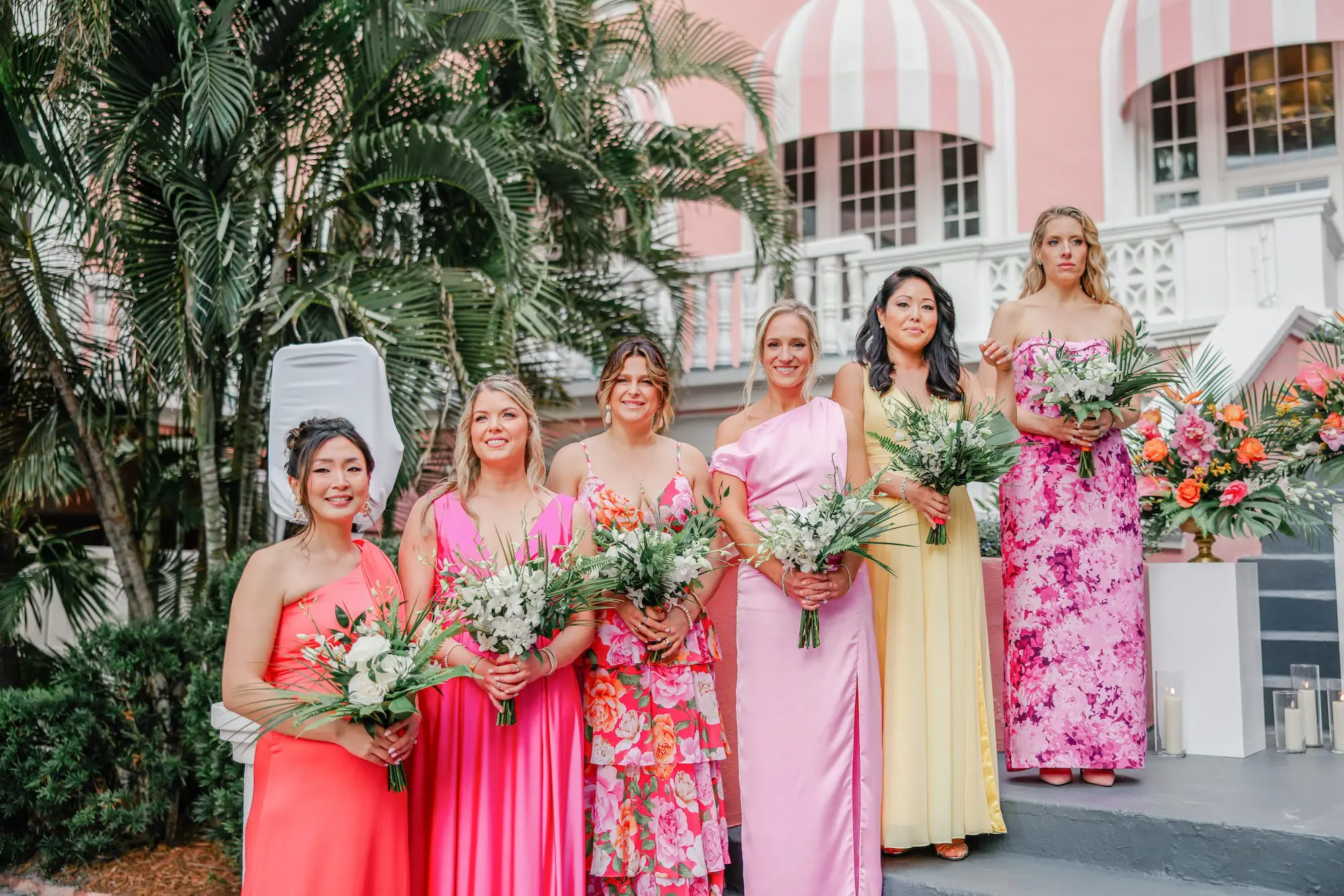 17Luxurious Vibrant Tropical Florida Wedding - Vibrant, Tropical St. Pete Beach Wedding | The Don CeSar Mismatched Pink and Yellow Tropical Bridesmaids Wedding Dress Ideas