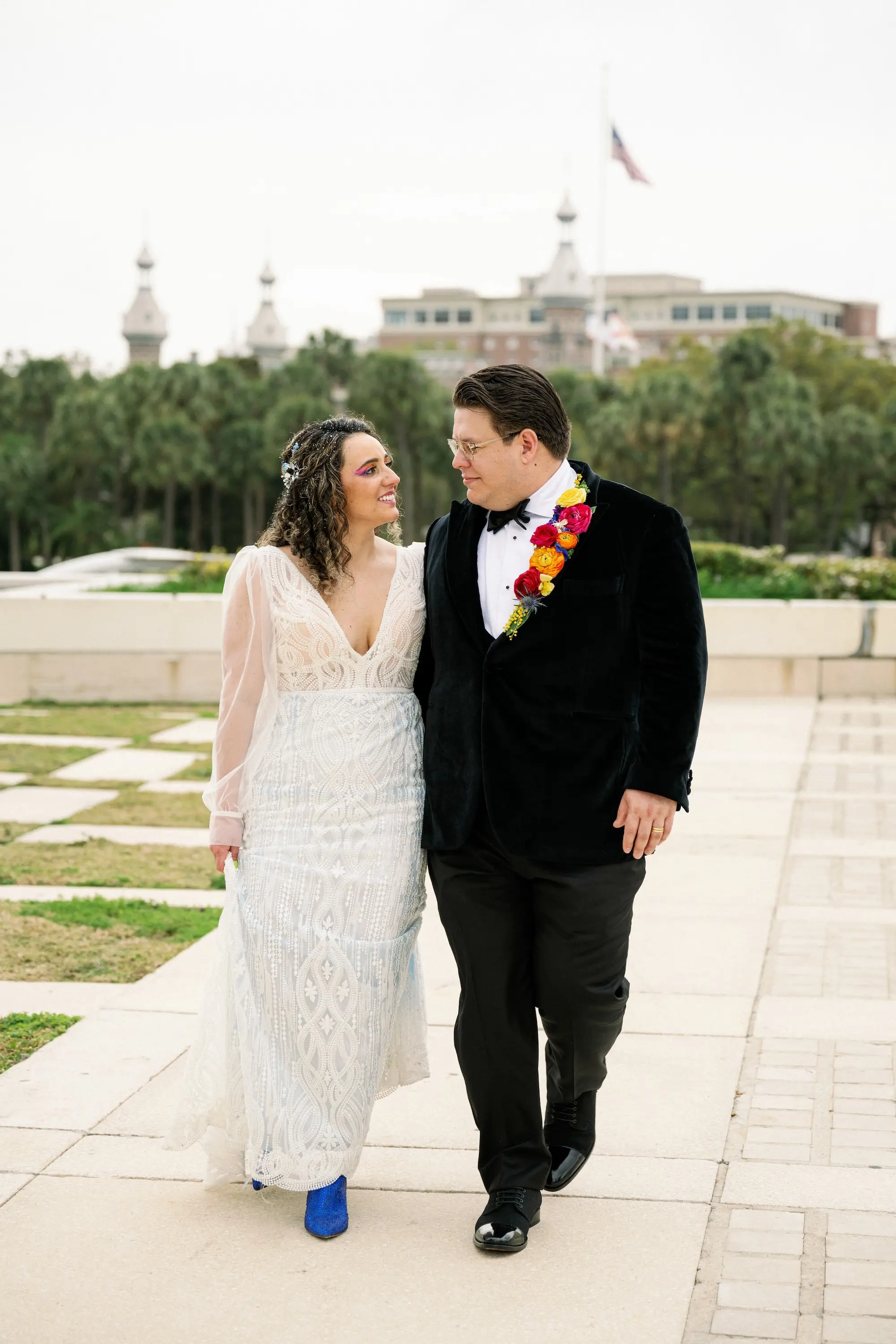 17Whimsical Rainbow Inspired Wedding Ideas - Whimsical, Vibrant Downtown Tampa Wedding | Armature Works Bride and Groom Wedding Portrait | Red, Yellow, Orange Floral Lapel Boutonniere Ideas | Half Up Half Down Voluminous Curls Bridal Hair Inspiration | Vibrant Eyeshadow Ideas | Ybor Hair and Makeup Artist Adore Bridal Hair and Makeup | Tampa Bay Photographer Dewitt For Love Photography