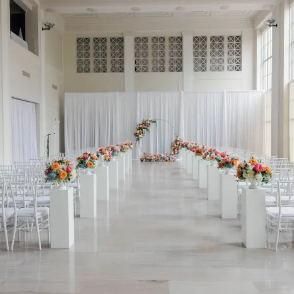 European Inspired Blue and Green Wedding Ceremony Decor Ideas | White Chiavari Ceremony Chairs Inspiration | Pink, Orange, Coral, Peach, White, Light Blue Florals in Greenery Flower Arrangement Decor Ideas | Tampa Bay Kate Ryan Event Rentals | Historic Downtown Tampa Wedding Venue The Vault | Florist Monarch Events and Design
