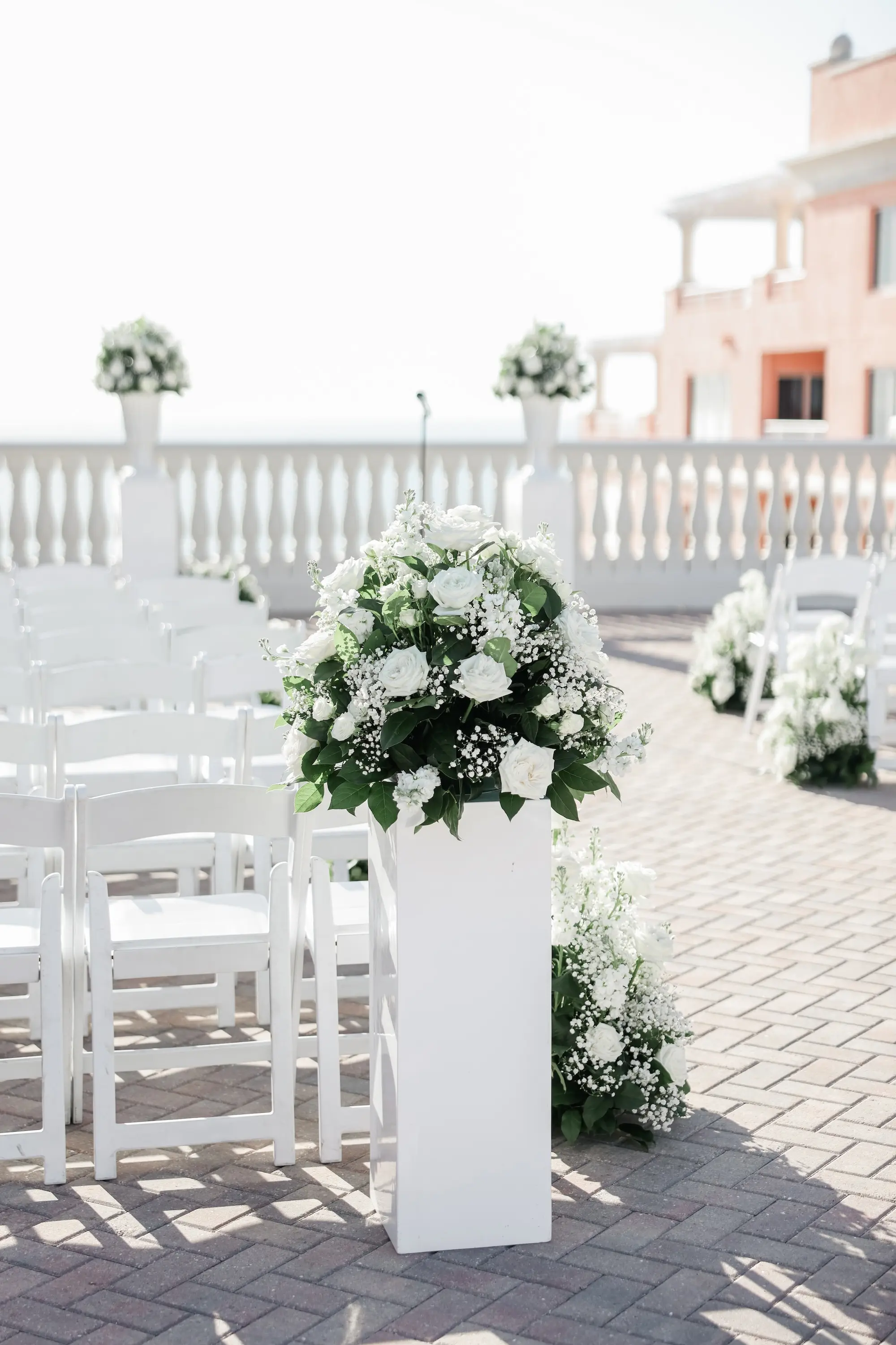 25Classic White Florida Wedding Ideas - Classic, White Rooftop Wedding | Hyatt Regency Clearwater Beach Balcony Oceanview Wedding Ceremony Portrait | White Ceremony Chairs Inspiration | Monochromatic White Roses and Baby's Breath Flower Arrangement Ceremony Decor Ideas | Florida Wedding Venue Hyatt Regency Clearwater Beach Resort and Spa