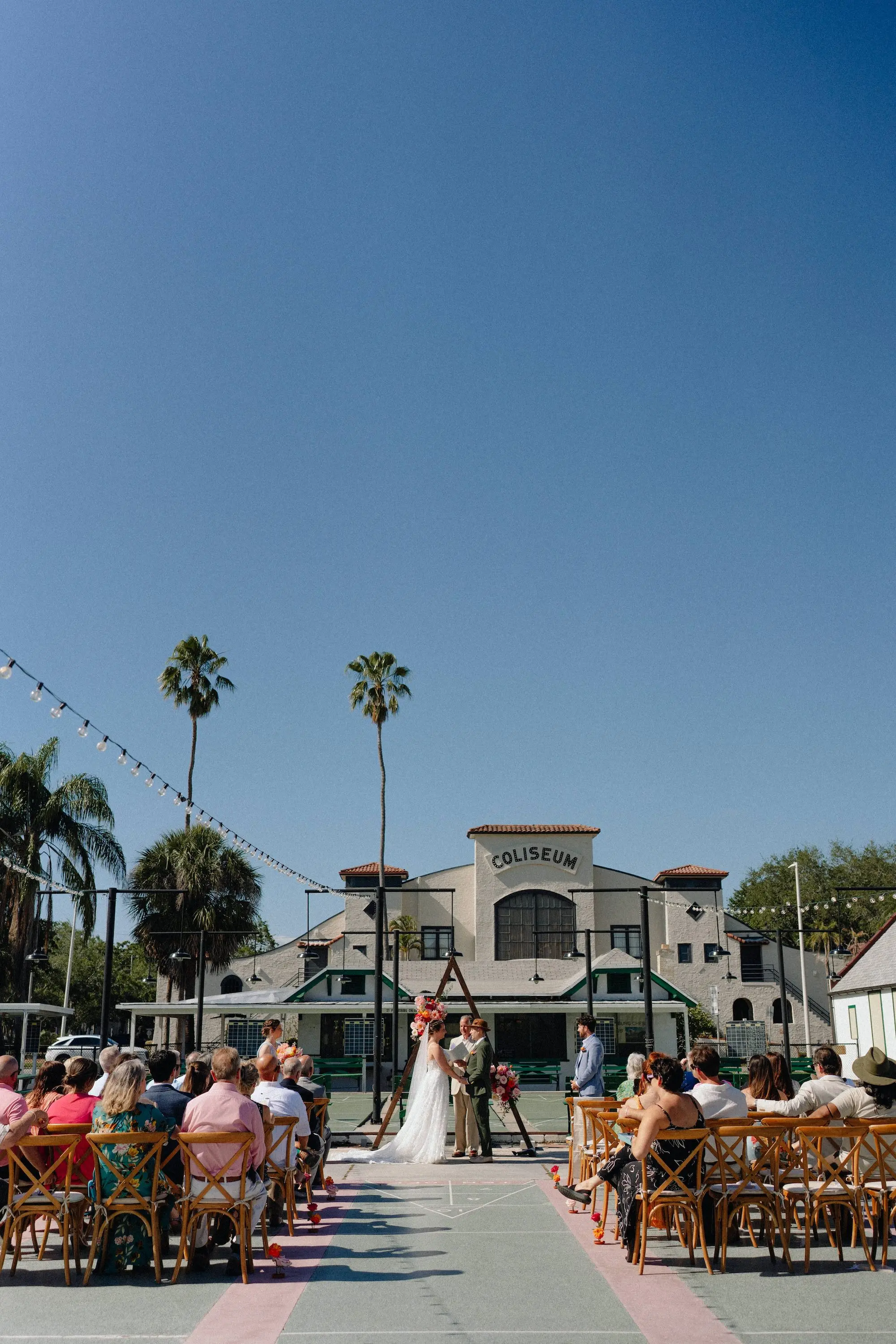 27Colorful Pink Yellow Orange Florida Wedding Inspiration St Petersburg Venue Shuffleboard Club - Whimsical, Colorful Outdoor Wedding | St. Pete Shuffleboard Club Colorful Pink, Yellow, and Orange Florida Wedding Ceremony Decor Inspiration | St Pete Event Venue Shuffleboard Club | Planner Wilder Mind Events
