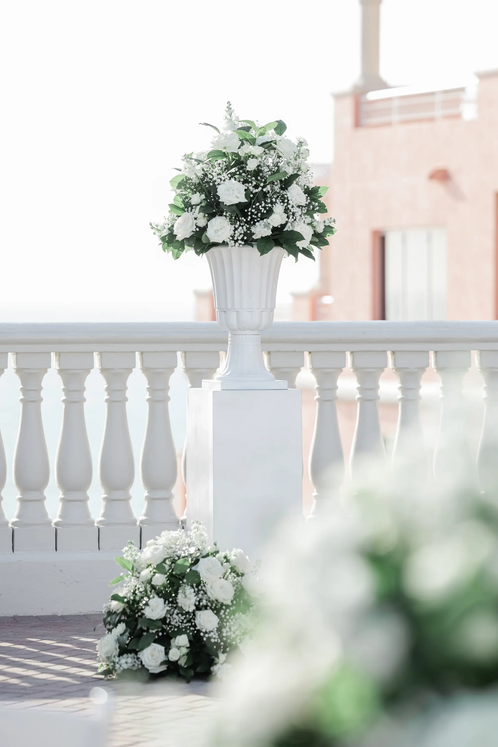 28Classic White Florida Wedding Ideas - Classic, White Rooftop Wedding | Hyatt Regency Clearwater Beach Monochromatic White Roses and Baby's Breath Flower Arrangement on White Columns Ceremony Decor Ideas | Tampa Bay Planner Planner Coastal Coordinating | St Pete Rentals Gabro Event Services
