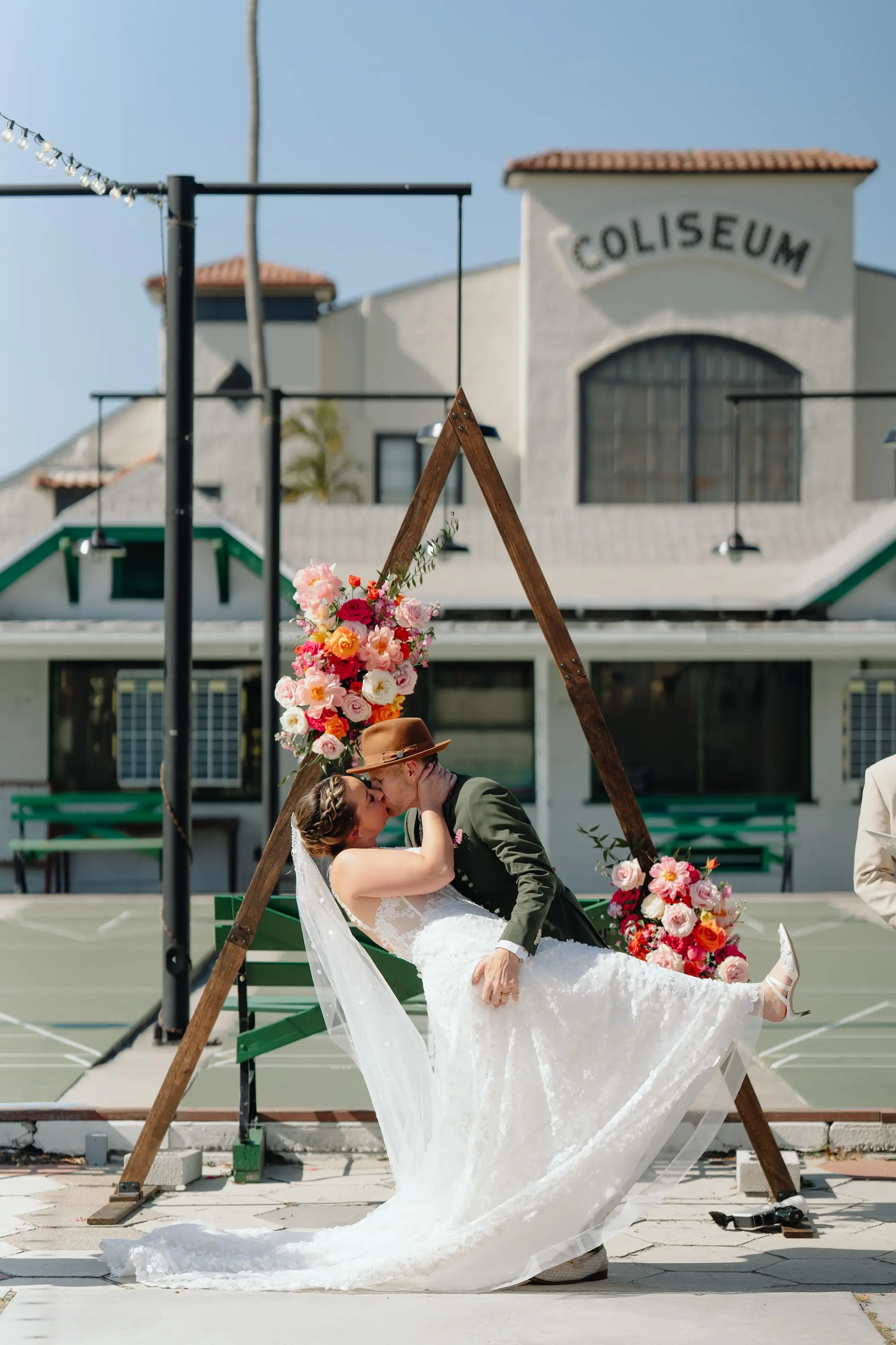 28Colorful Pink Yellow Orange Florida Wedding Inspiration - Whimsical, Colorful Outdoor Wedding | St. Pete Shuffleboard Club Bride and Groom First Kiss Wedding Portrait | St Pete Photographer J&S Media | Tampa Bay Content Creator Behind The Vows