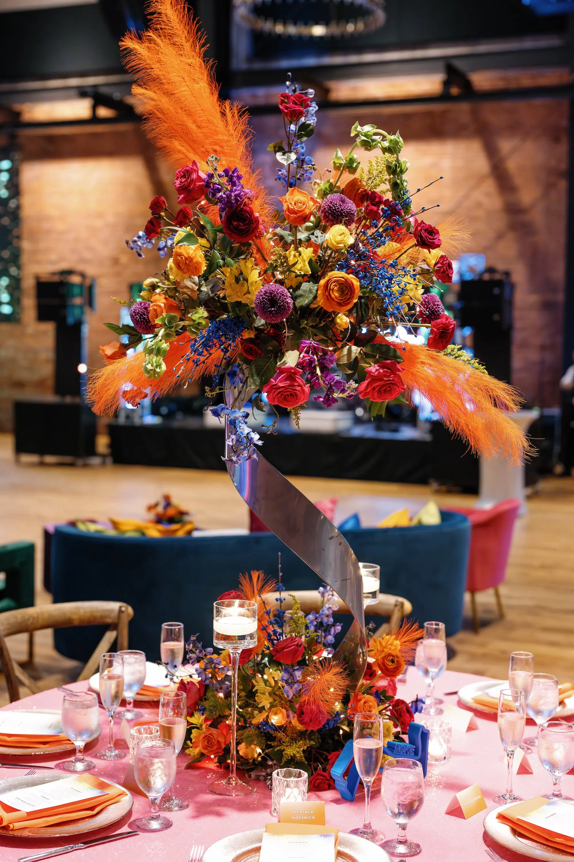 30Whimsical Rainbow Inspired Wedding Ideas - “Best Of” 2025: Wedding Receptions Part 2 Bright Colorful Rainbow Wedding Reception Sweetheart Table Decor Inspiration | Bright Pink Table Cloth Ideas | Red, Orange, Yellow, Green, Blue, Indigo, Violet Flower Arrangement Reception Decor Inspiration | Over The Top Rental Linens | Event Planner Unique Weddings and Events | Tabletop Rentals A Chair Affair