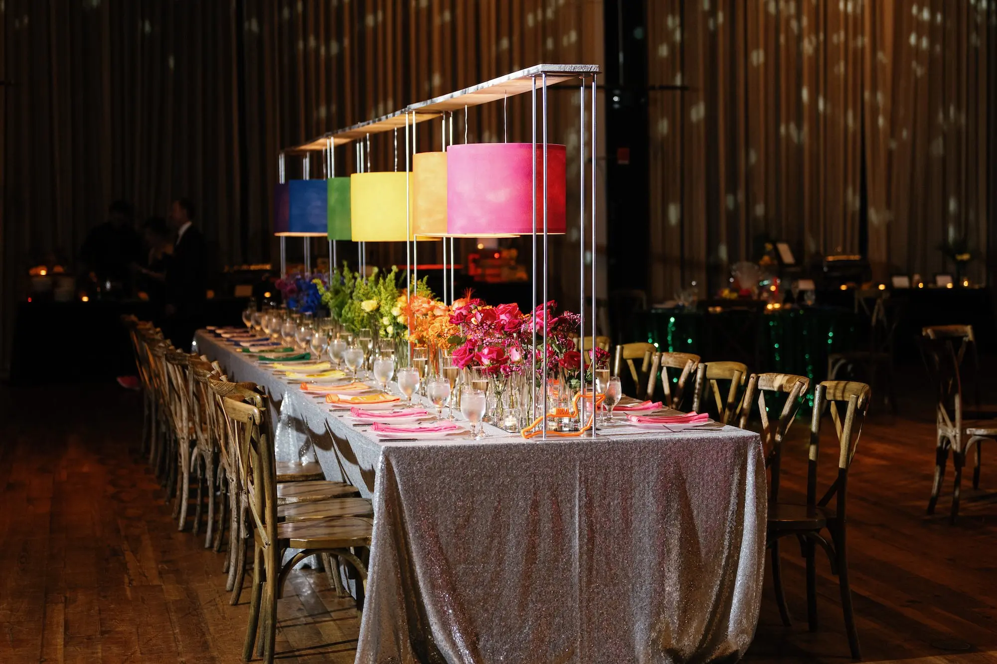 32Whimsical Rainbow Inspired Wedding Ideas Tampa Venue Armature Works - “Best Of” 2025: Wedding Receptions Part 2 Bright Colorful Rainbow Wedding Reception Long Table Decor Inspiration | Silver Sequined Table Cloth Ideas | Red, Orange, Yellow, Green, Blue, Indigo, Violet Flower Centerpiece Bud Vase Arrangement Decor Inspiration | Bold Rainbow Lighting Lamp Table Decor Ideas | Tabletop Rentals A Chair Affair | Over The Top Rental Linens | Event Planner Unique Weddings and Events | Industrial Tampa Wedding Venue Armature Works