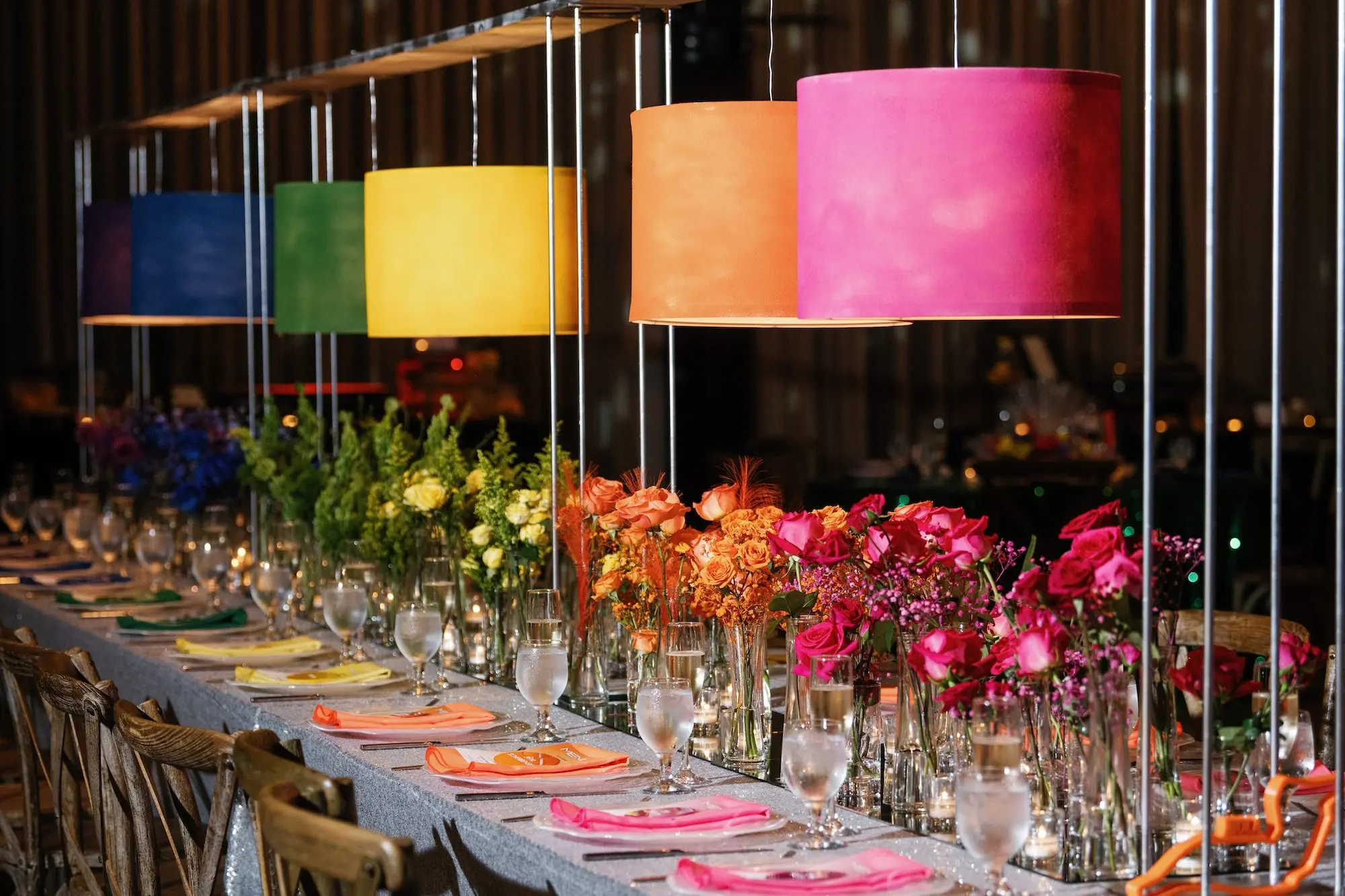 35Whimsical Rainbow Inspired Wedding Ideas - “Best Of” 2025: Wedding Receptions Part 2 Bright Colorful Rainbow Wedding Reception Long Table Decor Inspiration | Silver Sequined Table Cloth Ideas | Red, Orange, Yellow, Green, Blue, Indigo, Violet Flower Centerpiece Bud Vase Arrangement Decor Inspiration | Bold Rainbow Lighting Lamp Table Decor Ideas | Tabletop Rentals A Chair Affair | Over The Top Rental Linens | Event Planner Unique Weddings and Events | Industrial Tampa Wedding Venue Armature Works