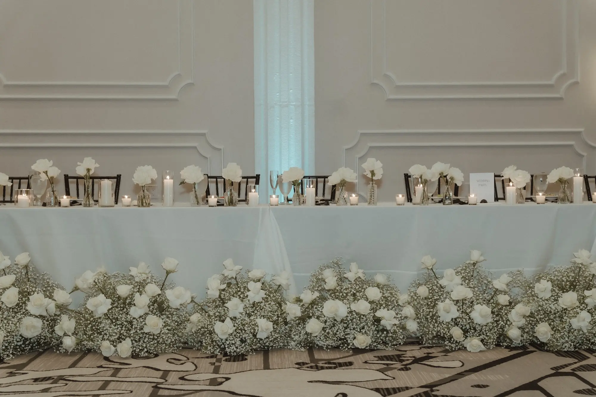 36Sophiscated Black and White Wedding Inspiration Tampa Venue Hotel Flor - “Best Of” 2025: Wedding Receptions Part 2 Classic Black and White Wedding Reception Decor Ideas | White Table Linens with Black Chiavari Chairs Decor Inspiration | Romantic Candles and Single Stem White Roses in Bud Vases Centerpiece Decor Ideas | Monochromatic White Roses and Baby's Breath Floral Arrangement Decor Inspiration | Tampa Bay Planner The Olive Tree Weddings