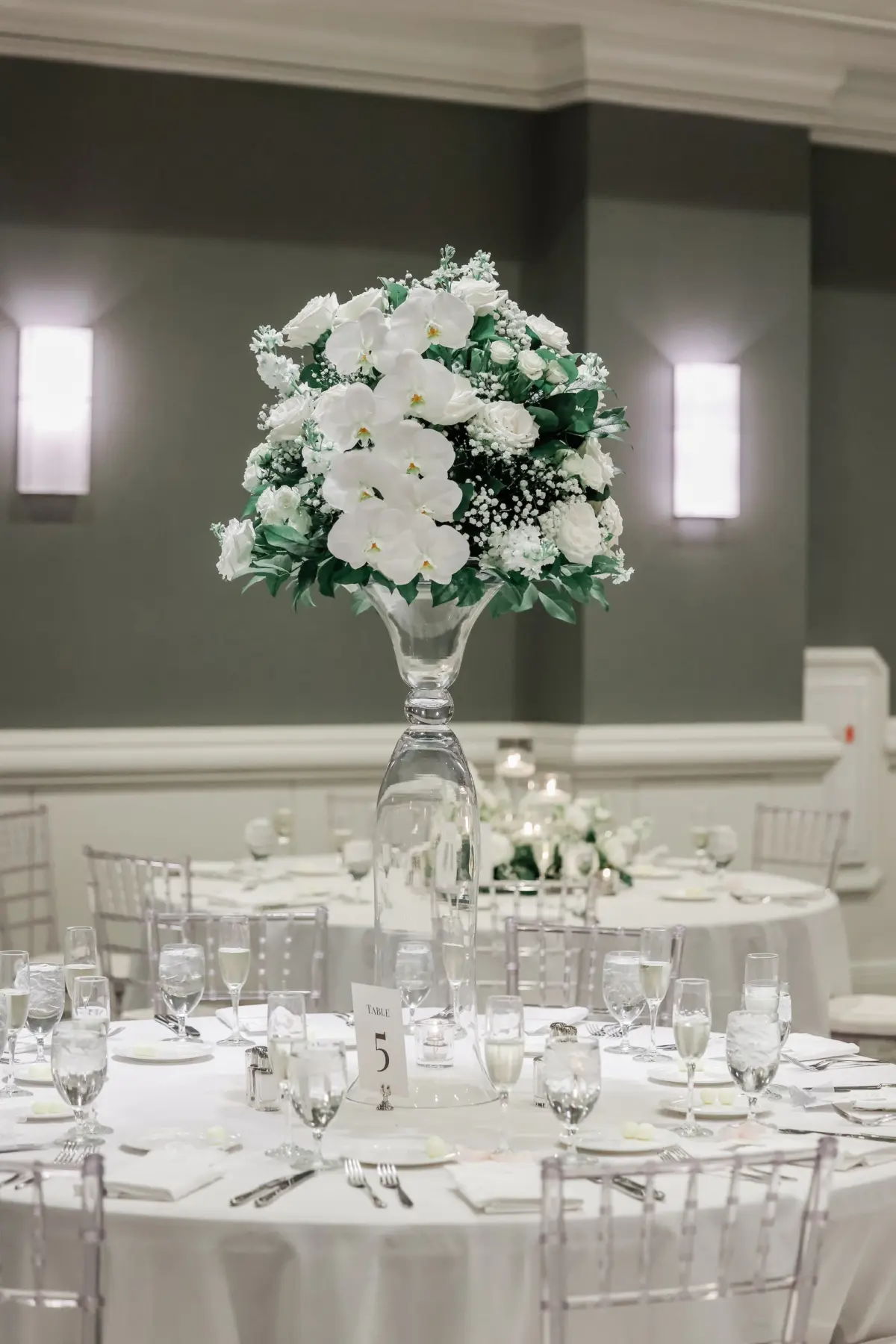 43Classic White Florida Wedding Ideas - Classic, White Rooftop Wedding | Hyatt Regency Clearwater Beach Luxurious Monochromatic White Ballroom Wedding Reception | Modern Clear Chiavari Chairs | Tall Glass Centerpieces with White, Roses and Greenery Flower Arrangement Ideas | Tampa Bay Planner Planner Coastal Coordinating | St Pete Rentals Gabro Event Services | Wedding Venue Hyatt Regency Clearwater Beach Resort and Spa