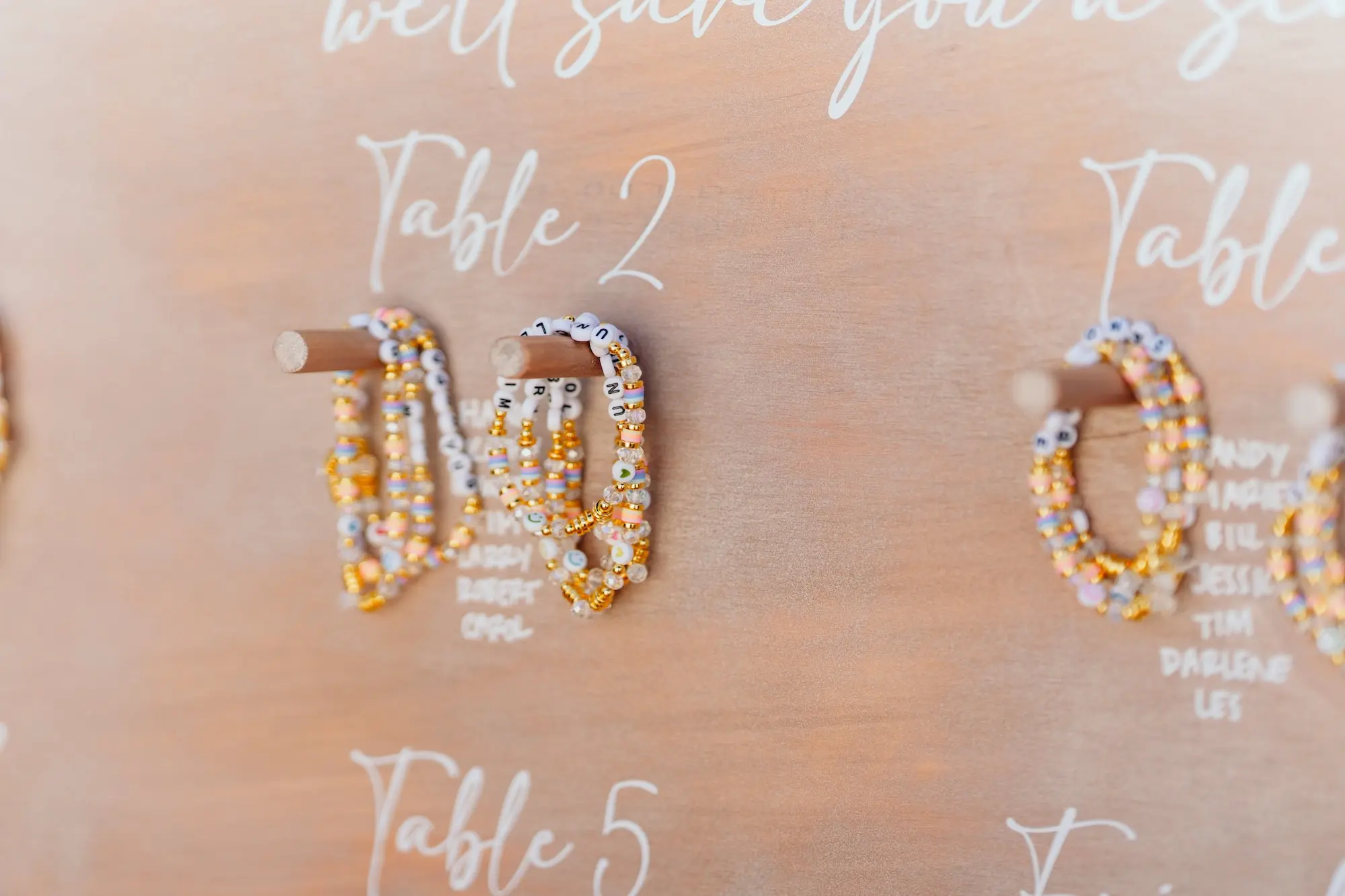 46Colorful Pink Yellow Orange Florida Wedding Inspiration - “Best Of” 2025: Wedding Receptions Part 2 Wedding Guest Bracelet Gift Seating Chart Ideas | Tampa Bay Event Planner Wilder Mind Events