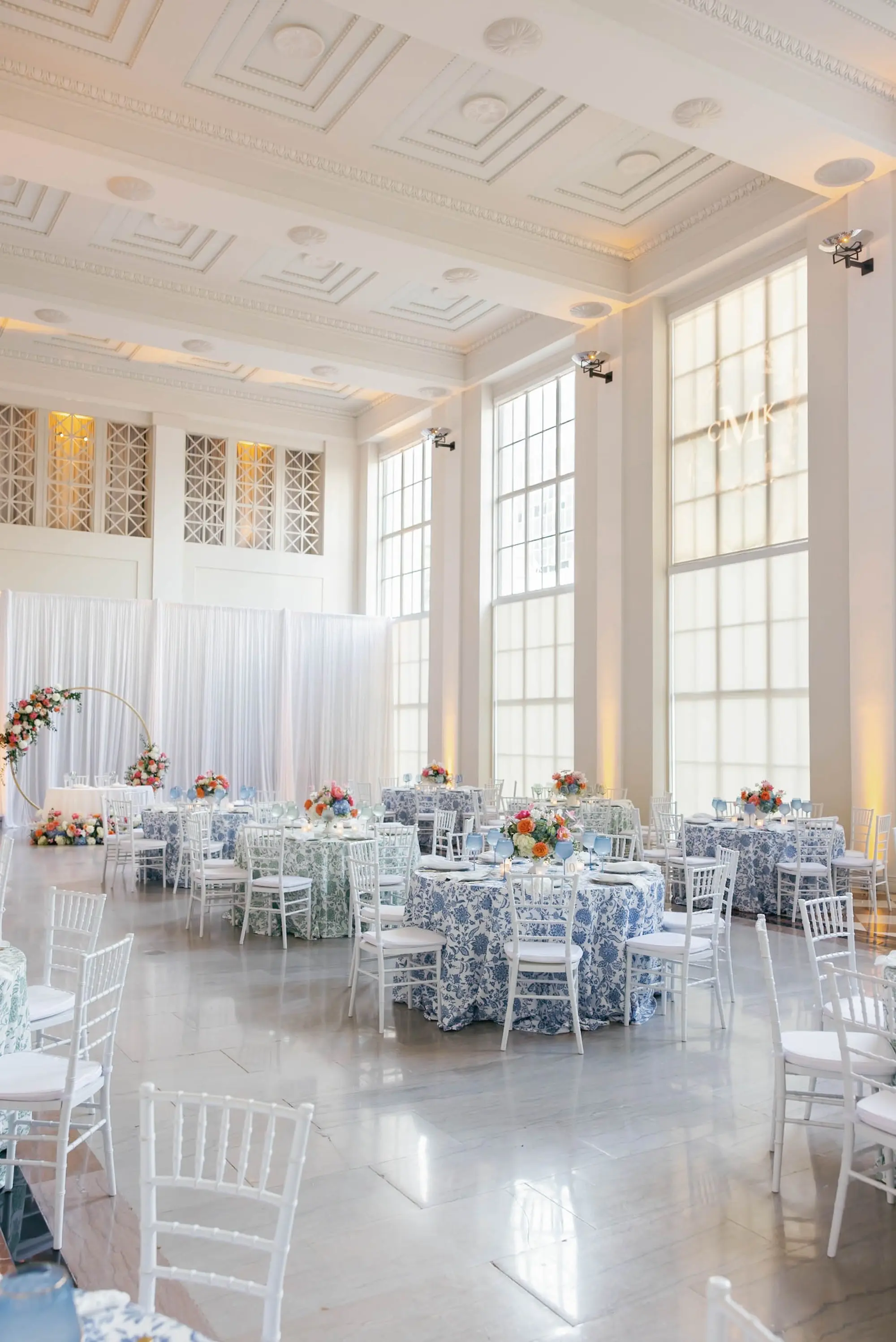 48European Inspired Blue and Green Wedding Inspiration Tampa Venue The Vault - “Best Of” 2025: Wedding Receptions Part 2 European Inspired Wedding Reception Decor Ideas | Floral Detailed Green and Blue Tablecloths Ideas | White Chiavari Wedding Reception Chairs Inspiration | Historic Chateau Inspired Wedding Venue The Vault | Florist Monarch Events and Design | Kate Ryan Event Rentals