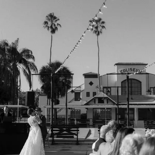 61Colorful Pink Yellow Orange Florida Wedding Inspiration St Petersburg Venue Shuffleboard Club - Whimsical, Colorful Outdoor Wedding | St. Pete Shuffleboard Club Bride and Groom First Dance Wedding Portrait | Tampa Bay DJ Grant Hemond and Associates | Venue St Petersburg Shuffleboard Club
