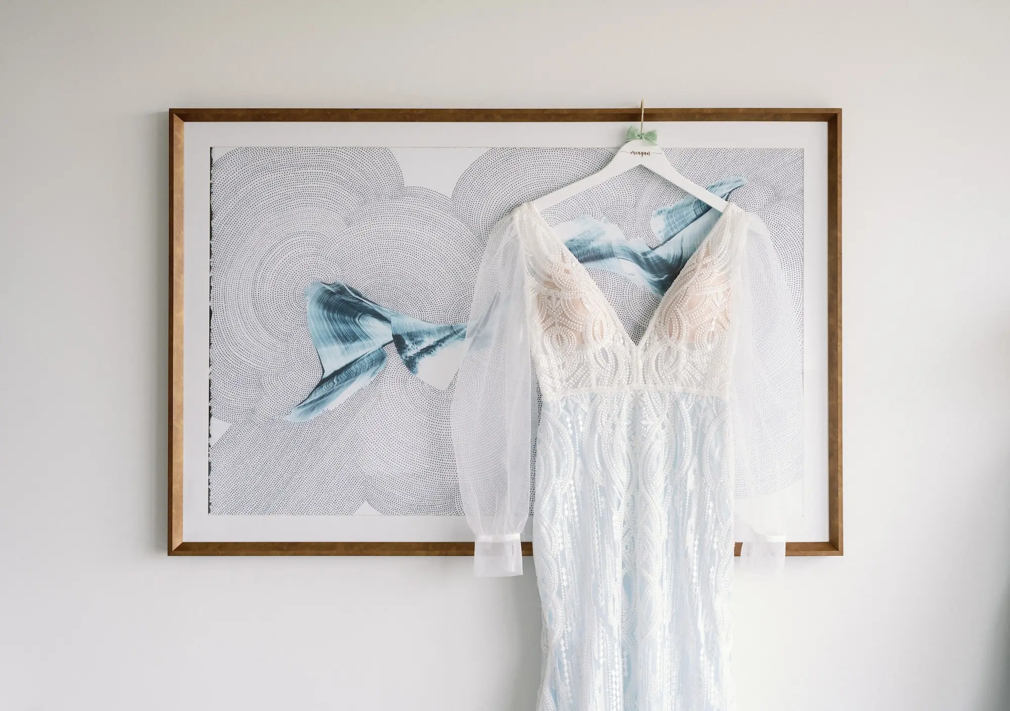 6Whimsical Rainbow Inspired Wedding Ideas - Whimsical, Vibrant Downtown Tampa Wedding | Armature Works White V-Neck Wedding Gown with Long, Sheer Sleeves hanging from White Hanger Ideas | Tampa Bay Photographer Dewitt For Love Photography