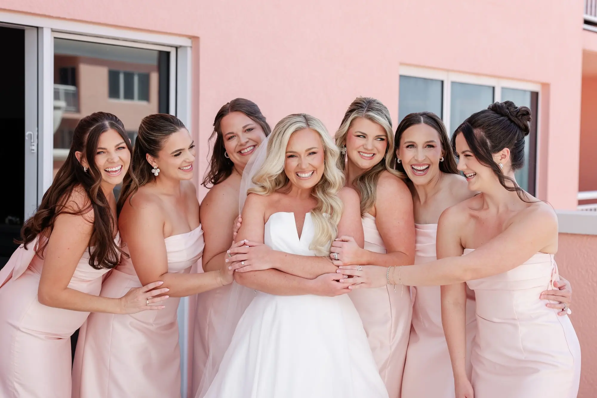 9Classic White Florida Wedding Ideas - Classic, White Rooftop Wedding | Hyatt Regency Clearwater Beach Bride and Bridesmaids Wedding Portrait | Strapless Light Pink Bridesmaid Dresses Inspiration | Tampa Bay Photographer Lifelong Photography Studio