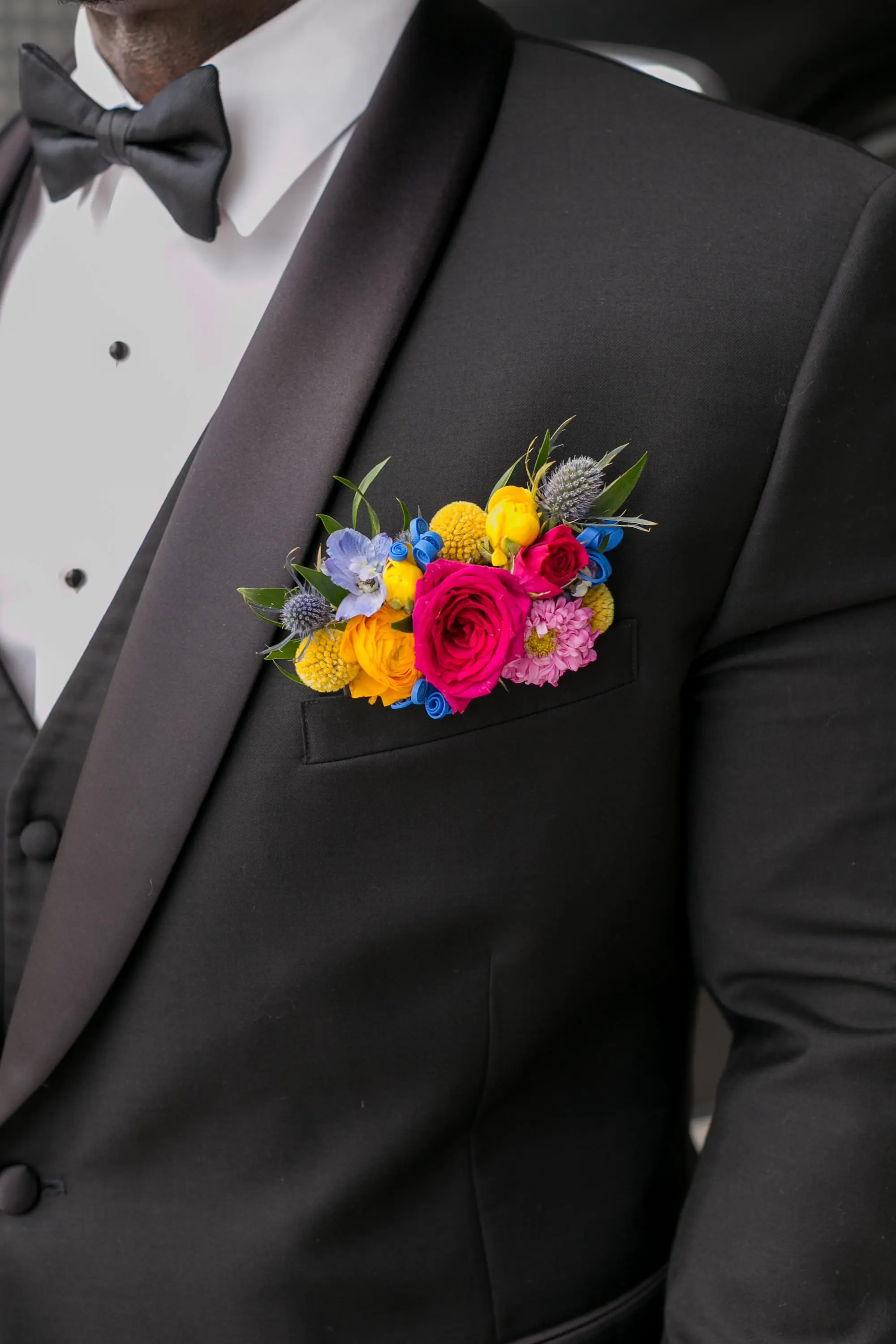 10Colorful Modern Yellow and Pink Wedding Ideas - Vibrant, Modern Gallery Wedding | Tampa Museum of Art Colorful Boutonniere with Pink, Yellow, and Blue Flowers Inspiration