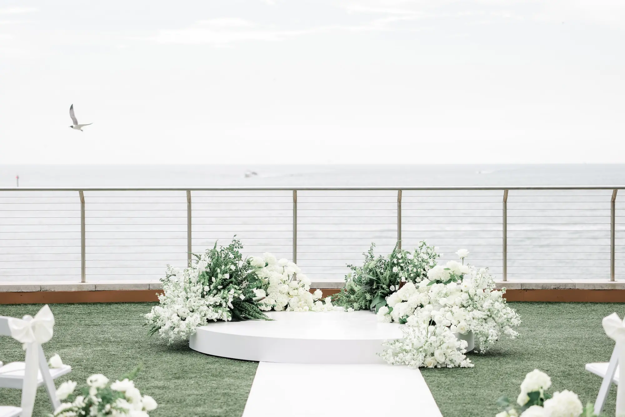 Chic Black and White Wedding Ceremony Altar Decor Inspiration | White Flowers with Greenery | Clearwater Event Venue Opal Sands | Kate Ryan Event Rentals