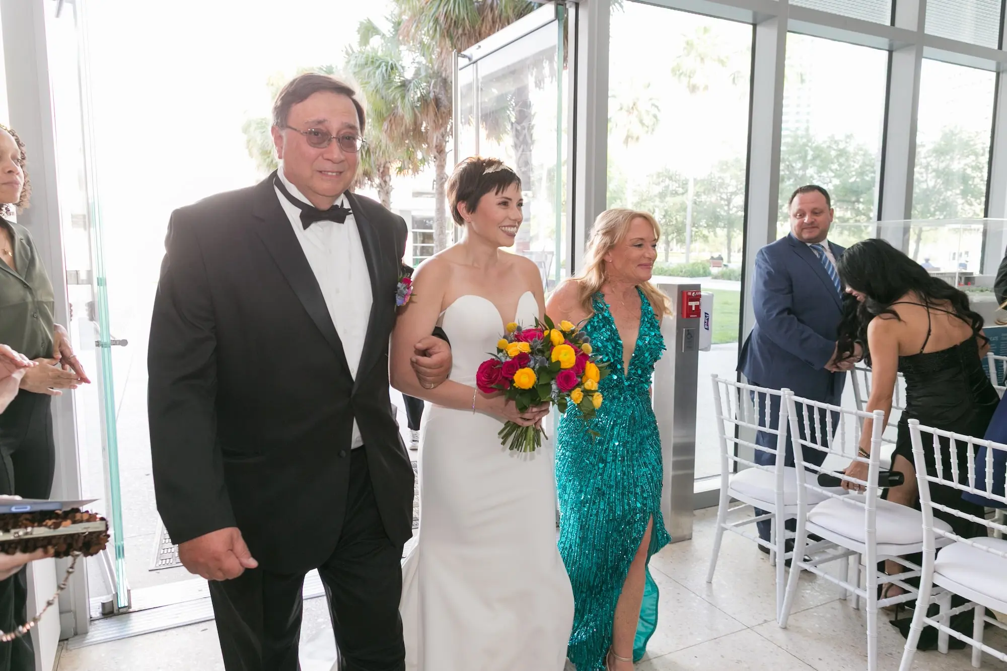 15Colorful Modern Yellow and Pink Wedding Ideas - Vibrant, Modern Gallery Wedding | Tampa Museum of Art Bride Walking Down Wedding Aisle with Parents Wedding Portrait