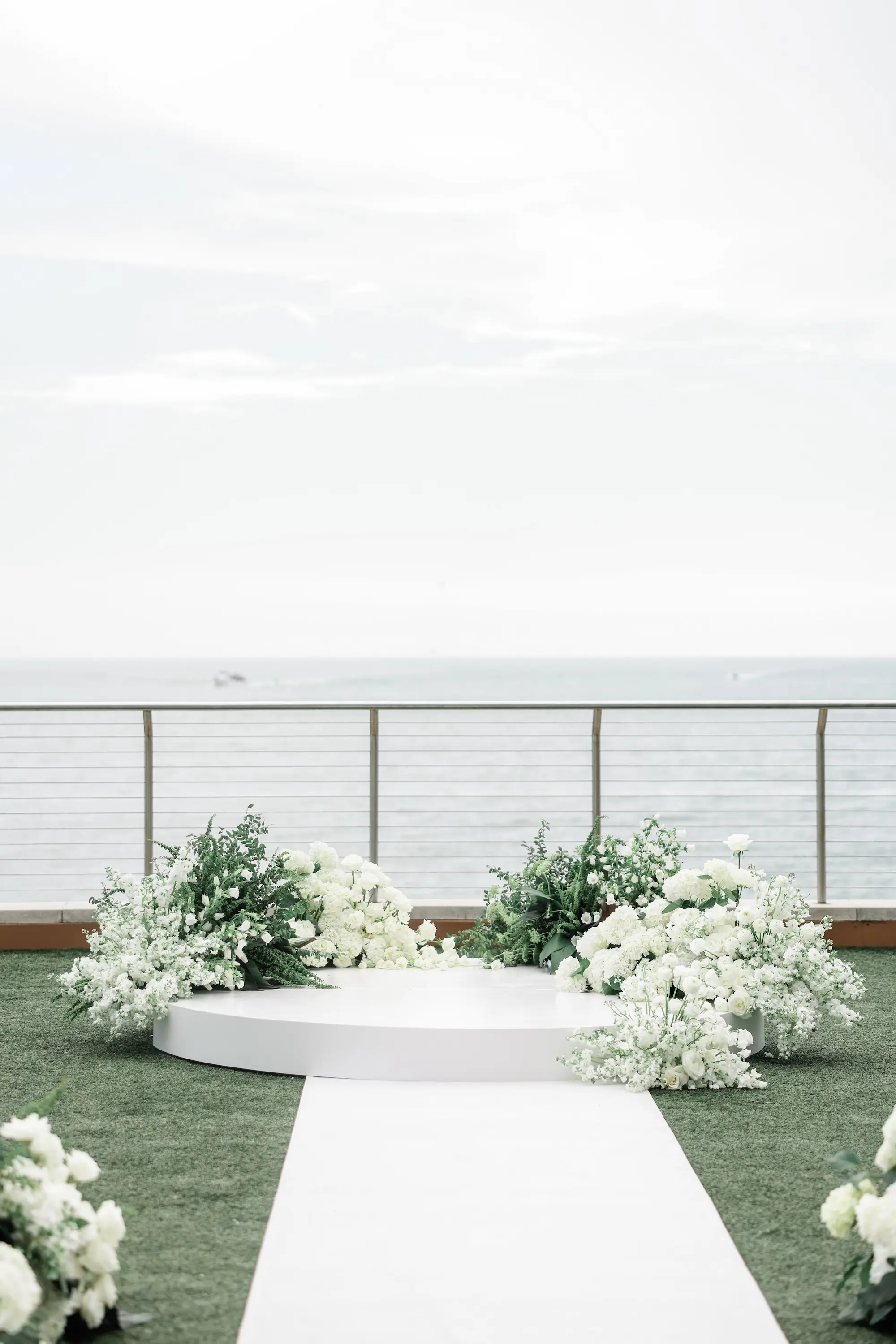 Chic Black and White Wedding Ceremony Altar Decor Inspiration | White Flowers with Greenery | Clearwater Event Venue Opal Sands | Kate Ryan Event Rentals