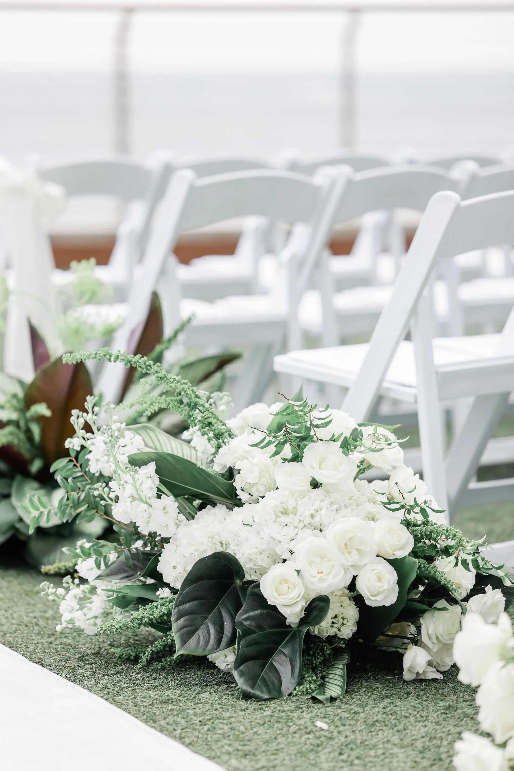 Chic Black and White Wedding Ceremony Aisle Decor Inspiration | White Flowers with Greenery
