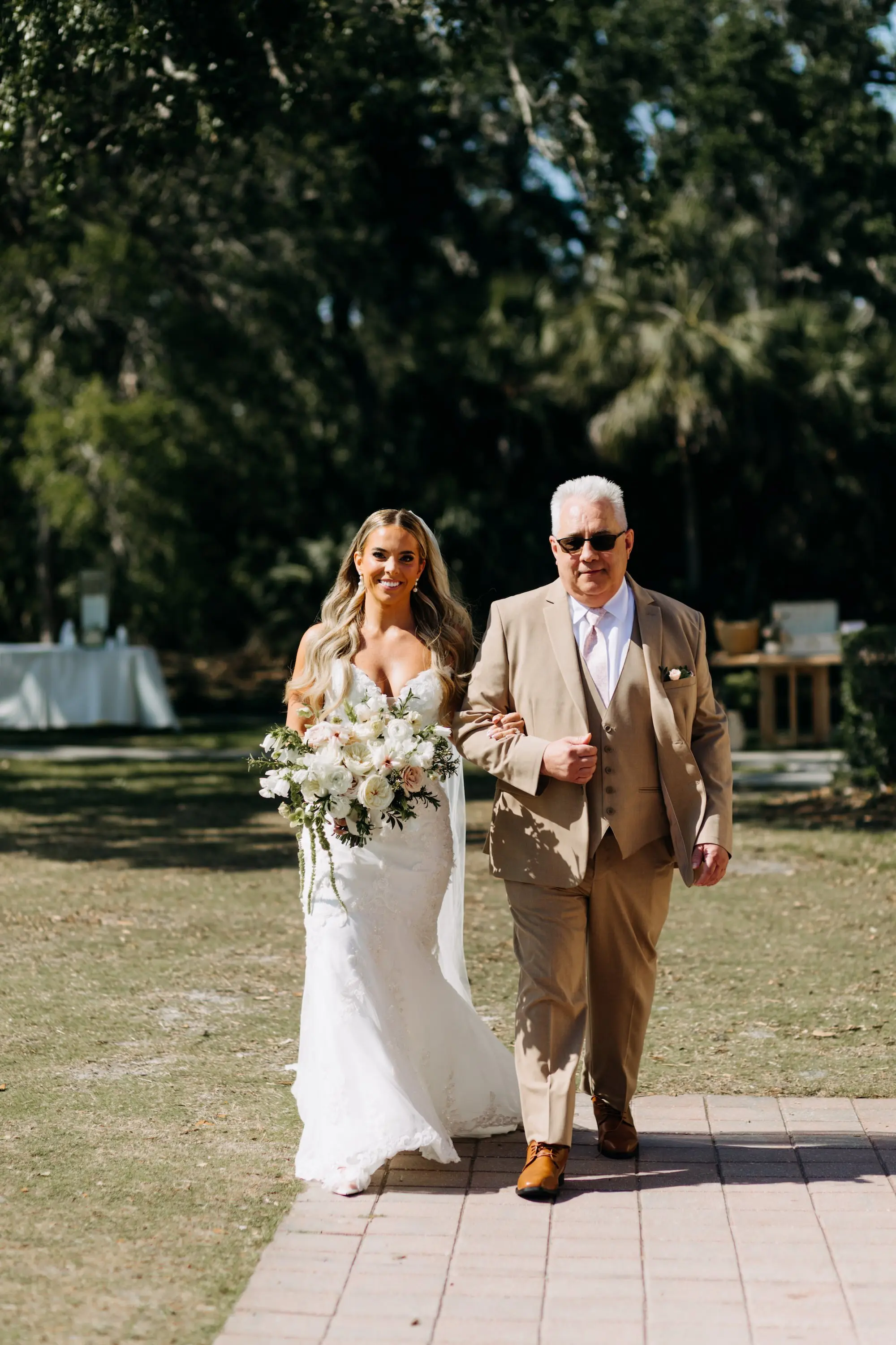 Bride and father Walking Down Wedding Aisle