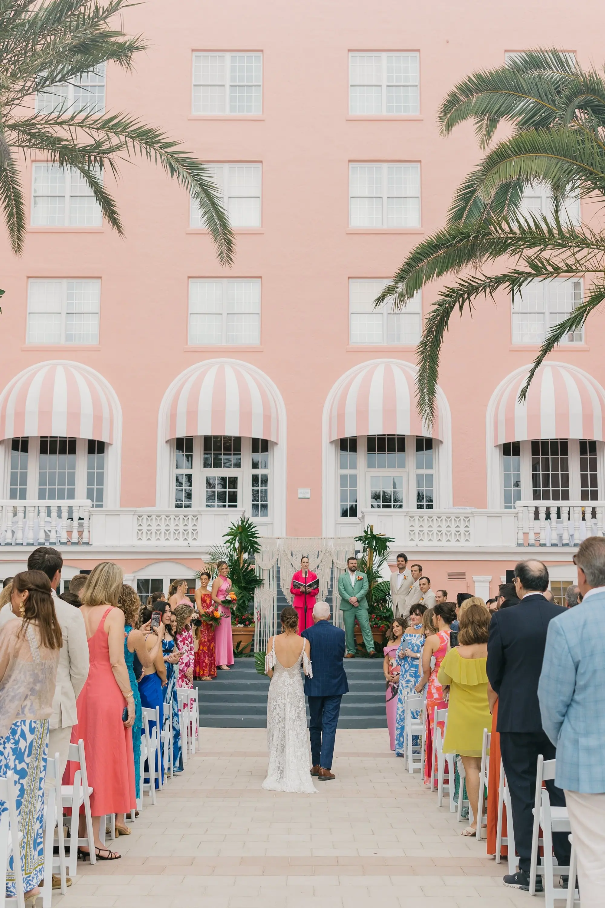 22Tropical Beach Boho Pink and Orange Wedding Inspiration St Pete Venue The Don CeSar - Vibrant, Tropical Boho St. Pete Beach Wedding | The Don CeSar Bride and Father Walking Down Wedding Ceremony Aisle | Tampa Bay Planner EventFull Weddings | Historic Pink Palace St Pete Beach Wedding Venue Don CeSar | St Pete Beach Resort Wedding Venue