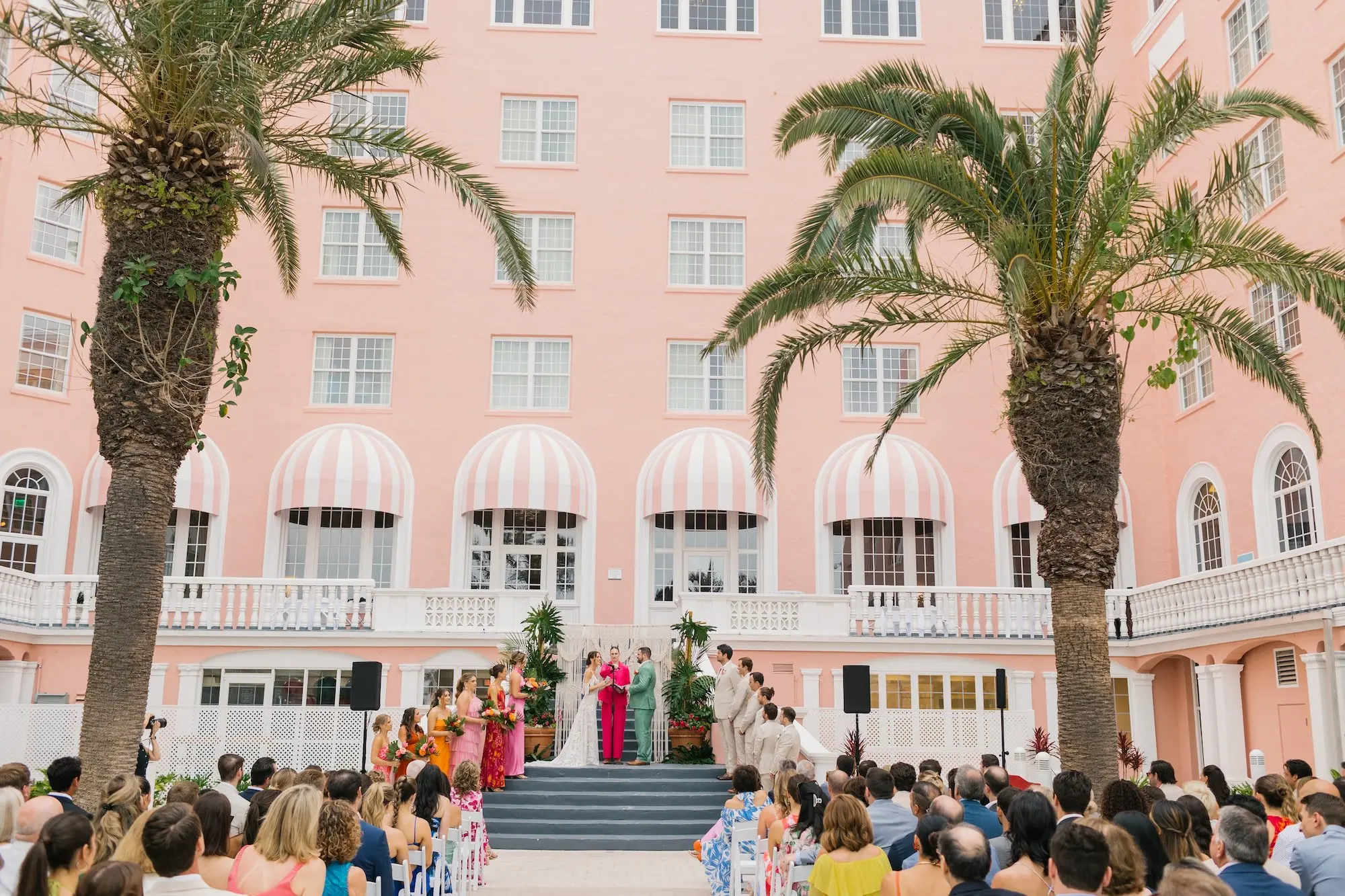 23Tropical Beach Boho Pink and Orange Wedding Inspiration St Pete Venue The Don CeSar - Vibrant, Tropical Boho St. Pete Beach Wedding | The Don CeSar Bride and Groom Wedding Ceremony Vow Exchange Wedding Portrait | Tampa Bay Planner EventFull Weddings | Historic Pink Palace St Pete Beach Wedding Venue Don CeSar | St Pete Beach Resort Wedding Venue