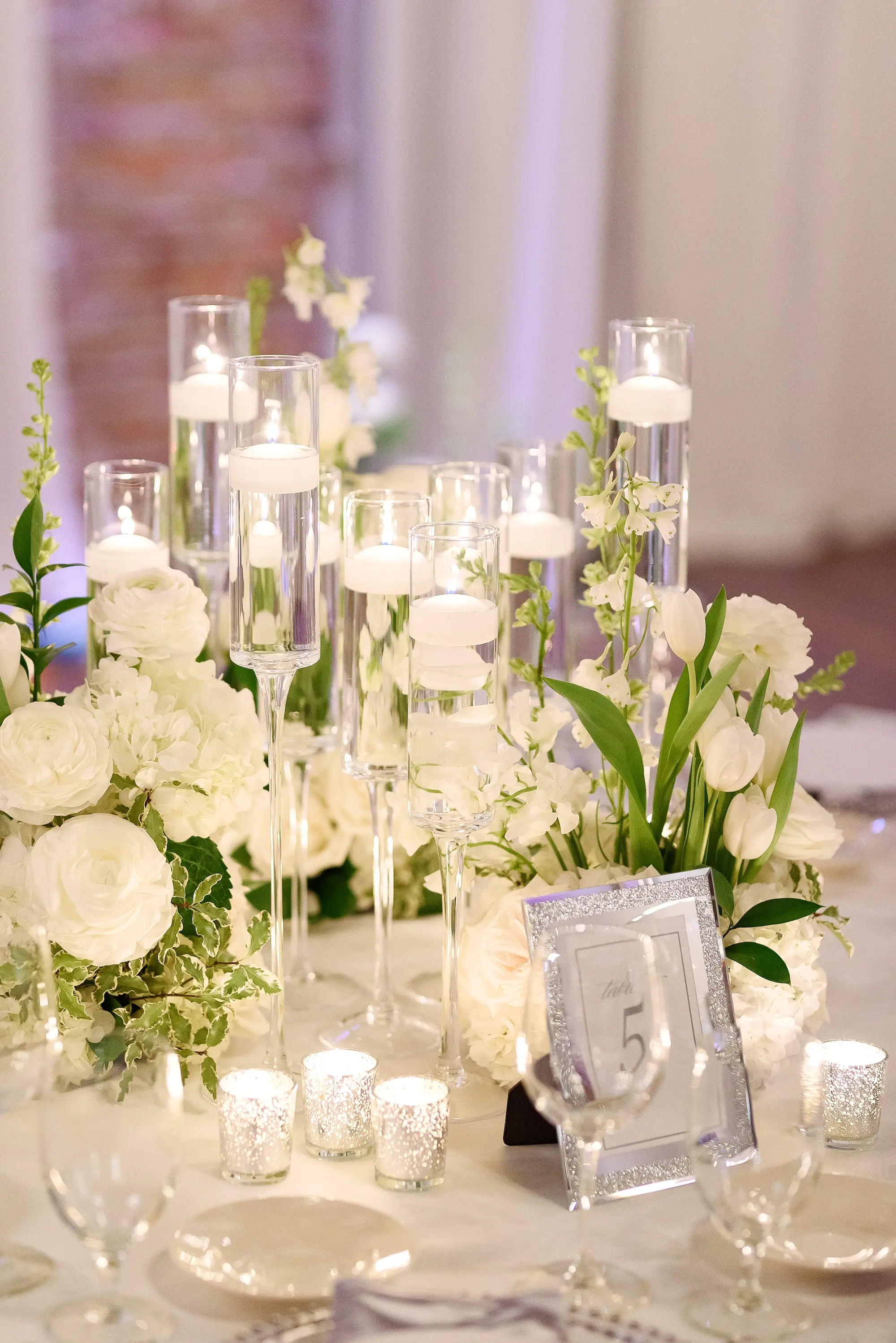 Silver Frame Table Numbers Wedding Reception Decor Inspiration | White Florals and Candles Centerpiece Inspiration | Tampa Bay Florist Bruce Wayne Florals