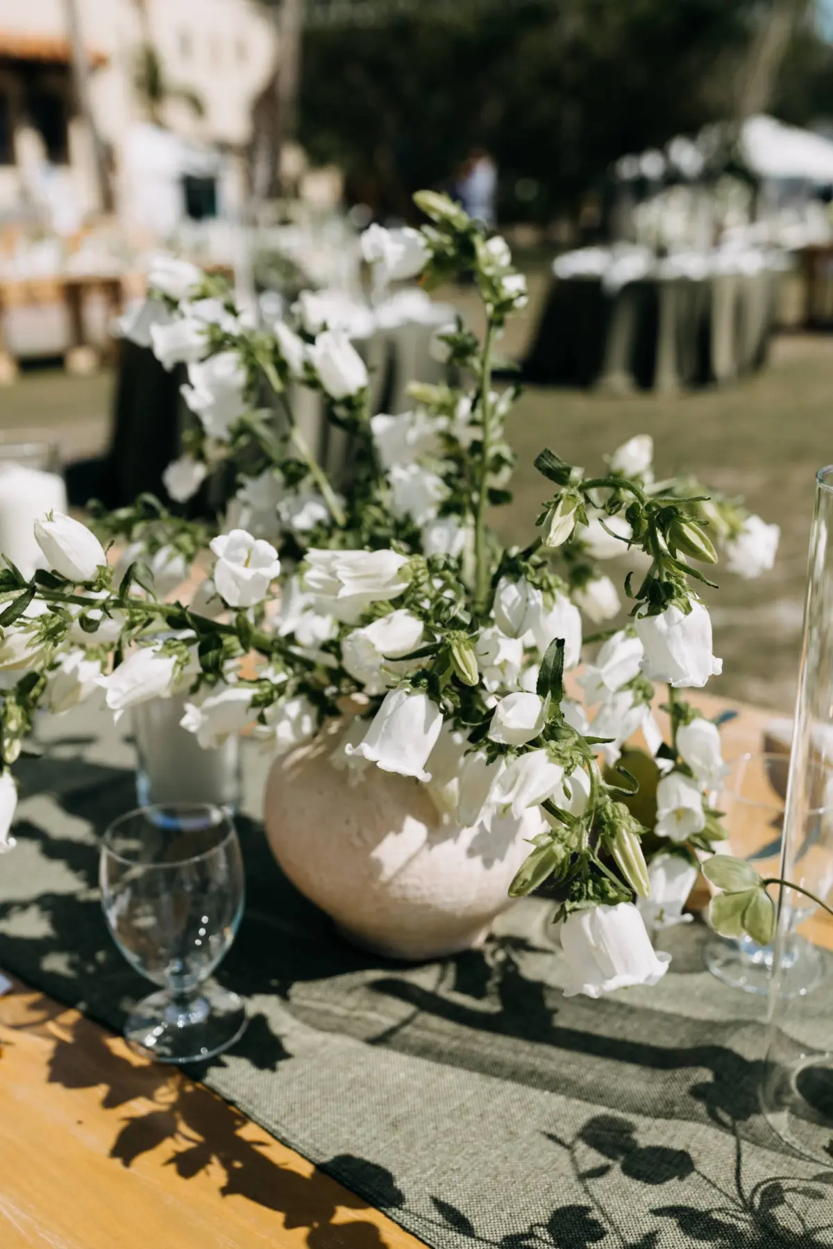 Romantic Outdoor Waterfront Green Garden Wedding Reception White Flower and Greenery Centerpiece Decor Inspiration