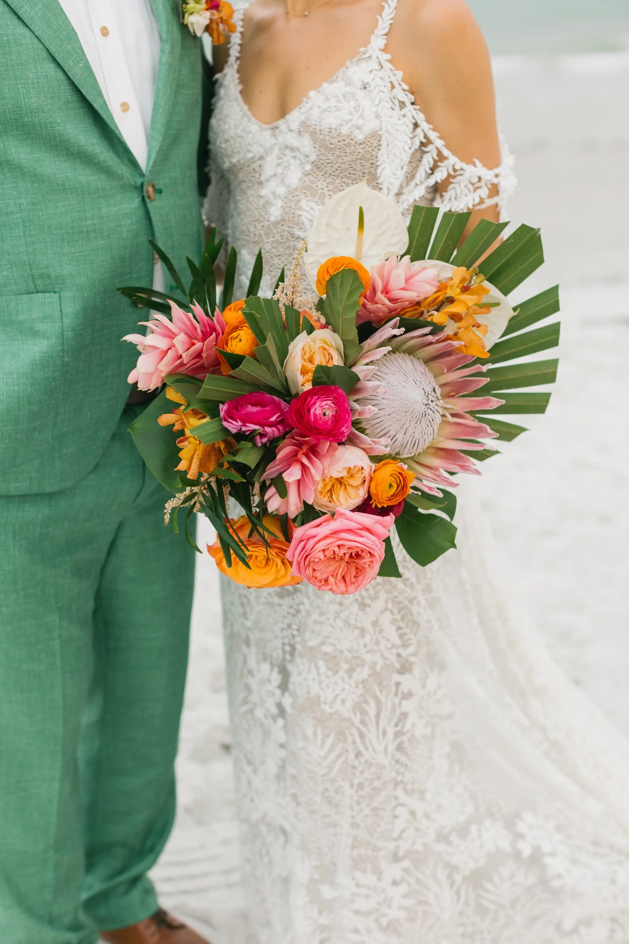 29Tropical Beach Boho Pink and Orange Wedding Inspiration - Vibrant, Tropical Boho St. Pete Beach Wedding | The Don CeSar Boho Tropical Pink, Orange, Red, White with Large Palm Fronds Floral Bridal Bouquet Ideas