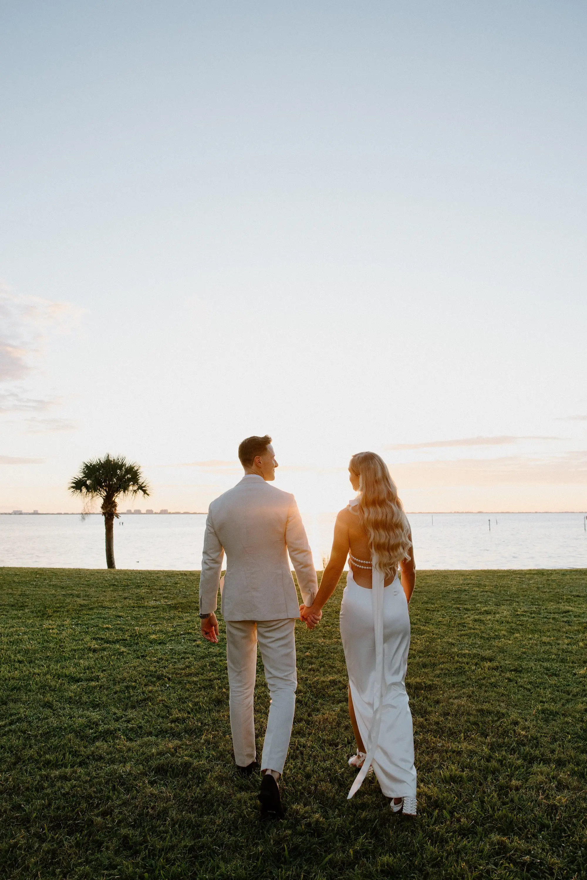 Bride and Groom Oceanfront Golden Hour Wedding Portrait | Hollywood Glam Curled Waves Wedding Bridal Hair Inspiration | Sarasota Hair and Makeup Artist Femme Akoi Beauty Studio