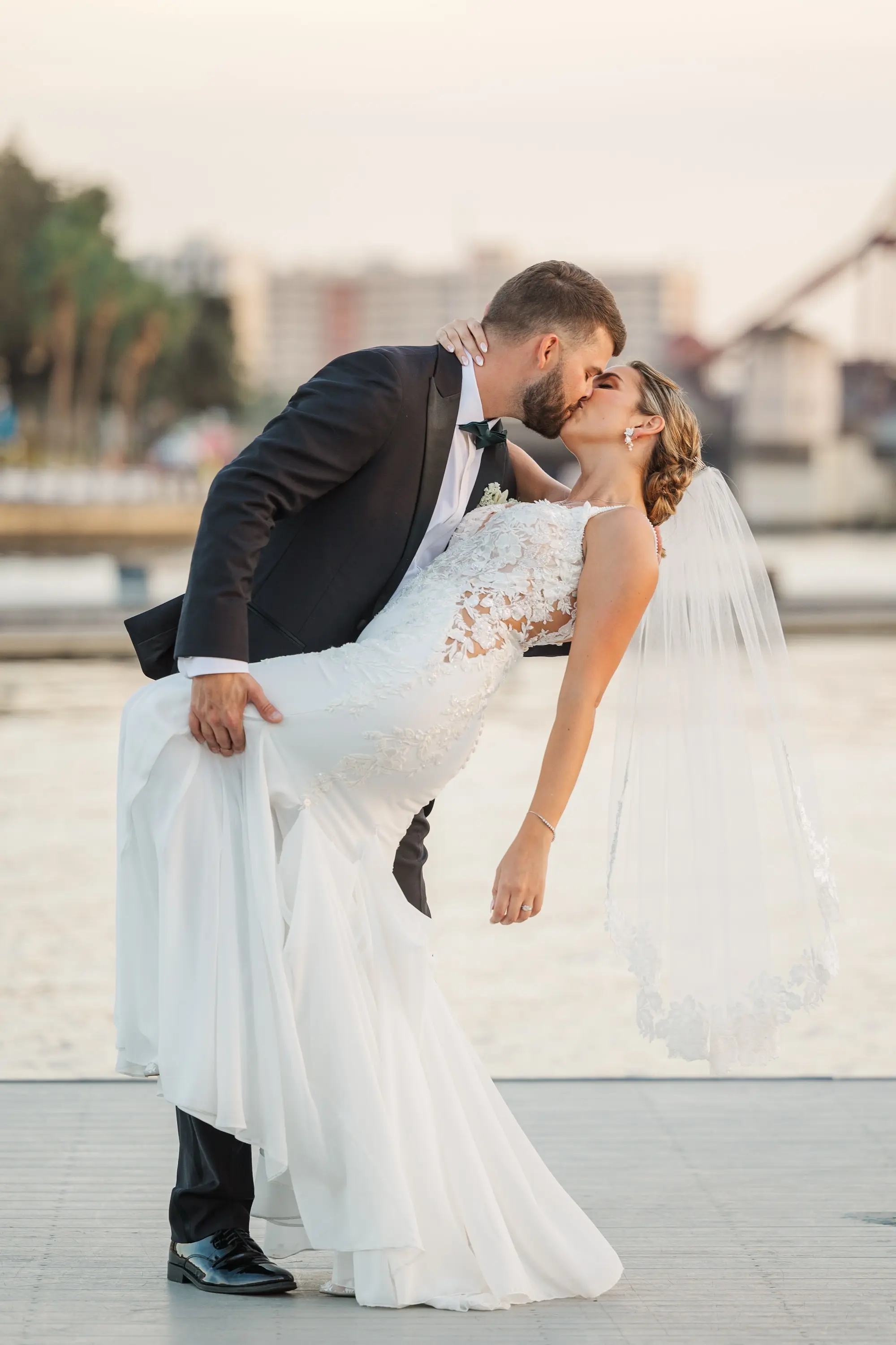 36Classic Emerald Green and Champagne Wedding Inspiration - Classic Emerald Green Downtown Tampa Wedding | Bob Buckhorn Center Bride and Groom Kissing Riverfront Wedding Portrait | Tampa Bay Photographer Mary Anna Photography
