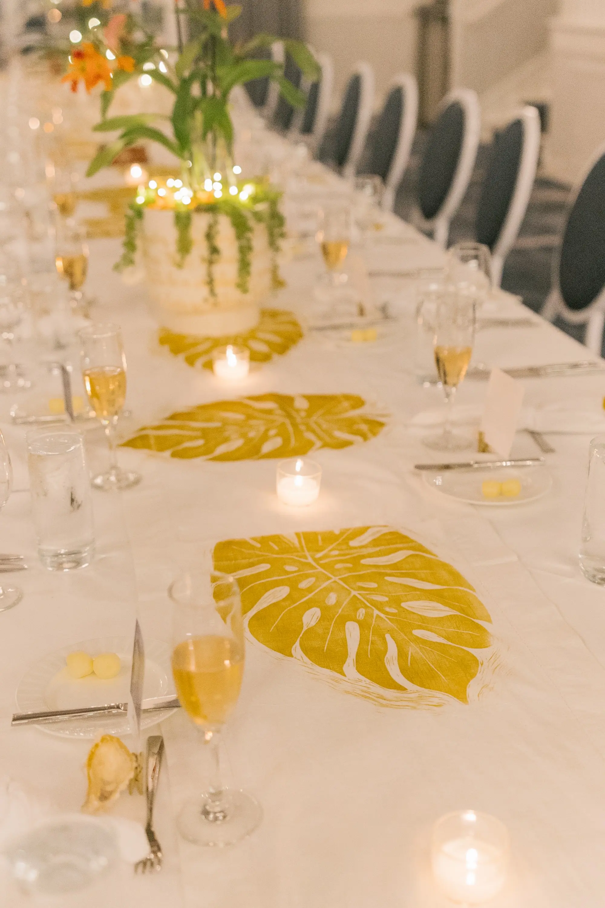 36Tropical Beach Boho Pink and Orange Wedding Inspiration - Vibrant, Tropical Boho St. Pete Beach Wedding | The Don CeSar Boho Beach Wedding Reception Decor Inspiration | Long Table with White Linens and Tropical Orange Florals and Ferns with Gold Palms Centerpieces Decor Ideas | Tampa Bay Planner EventFull Weddings