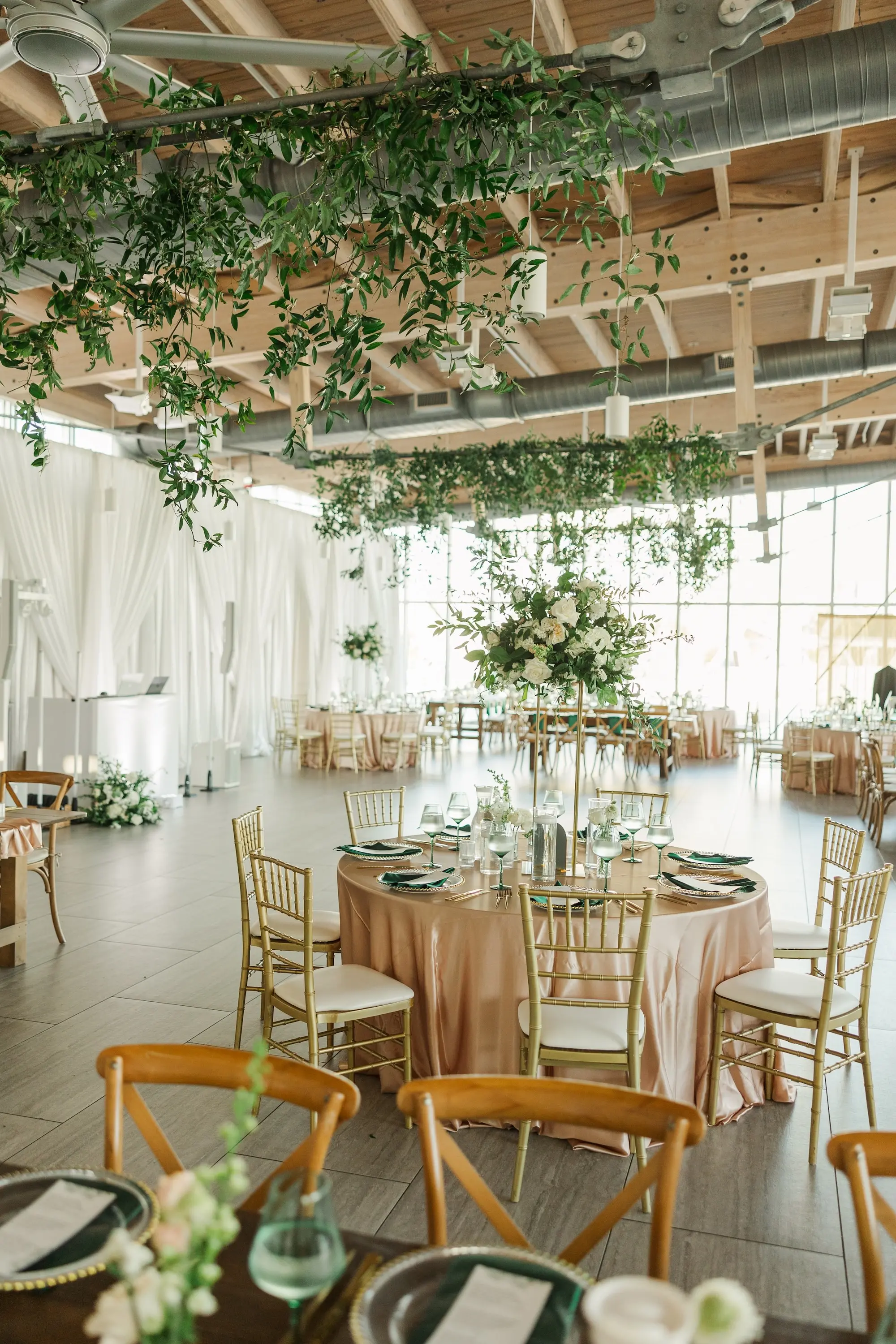 40Classic Emerald Green and Champagne Wedding Inspiration Bob Buckhorn Tampa River Center Venue - Classic Emerald Green Downtown Tampa Wedding | Bob Buckhorn Center Luxurious Riverfront Ballroom Wedding Reception | Gold Chiavari Chairs | Tall Gold Platform Centerpieces with White Hydrangeas, Roses, Wisteria Flower and Palm Greenery Arrangement Ideas | Clear Chargers with Gold Scalloped Edges and Emerald Green Napkins Tablescape Decor Inspiration | Tampa Bay Planner Wilder Mind Events | Florida Elite Events Catering | Venue Tampa River Center
