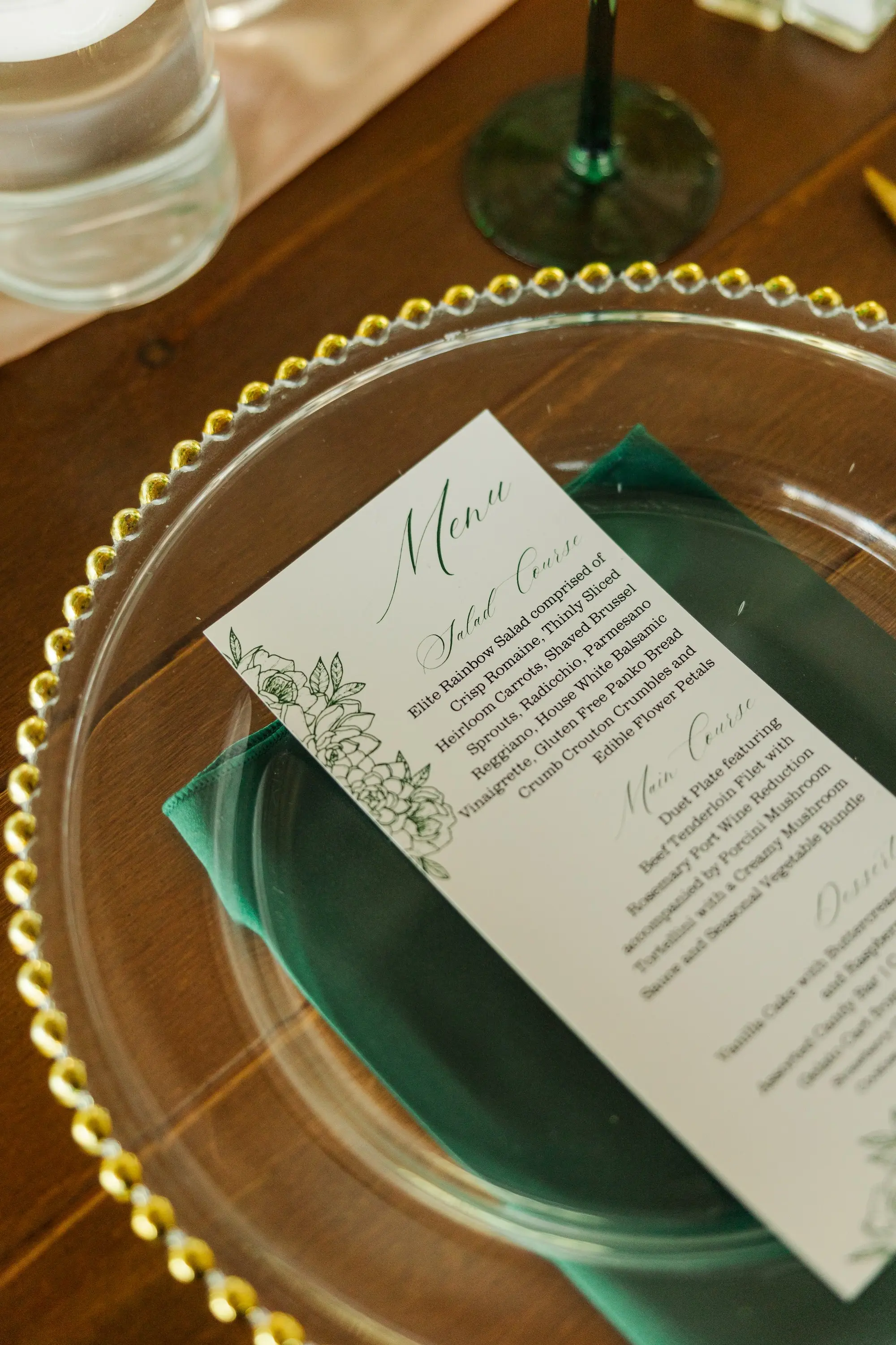 47Classic Emerald Green and Champagne Wedding Inspiration - Classic Emerald Green Downtown Tampa Wedding | Bob Buckhorn Center Clear Charger with Gold Scalloped Edges and Emerald Green Napkin with White Menu Card Wedding Reception Decor Inspiration | Tampa Bay Planner Wilder Mind Event