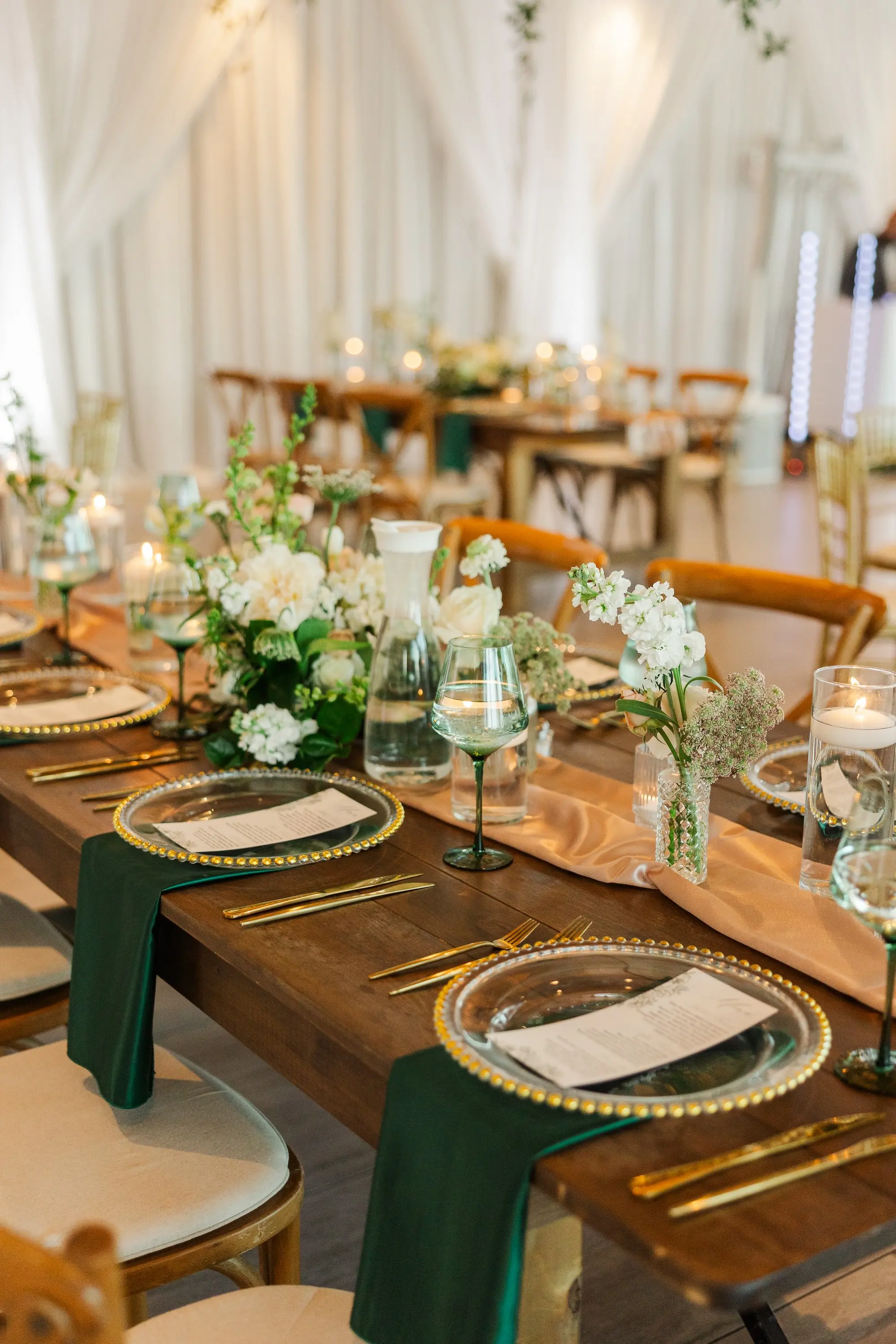 49Classic Emerald Green and Champagne Wedding Inspiration - Classic Emerald Green Downtown Tampa Wedding | Bob Buckhorn Center Romantic Riverfront Ballroom Wedding Reception | Gold Chiavari Chairs | Tall Gold Platform Centerpieces with White Hydrangeas, Roses, Wisteria Flower and Palm Greenery Arrangement Ideas | Clear Chargers with Gold Scalloped Edges and Emerald Green Napkins Tablescape Decor Inspiration | Tampa Bay Planner Wilder Mind Events | Florida Elite Events Catering | Venue Tampa River Center