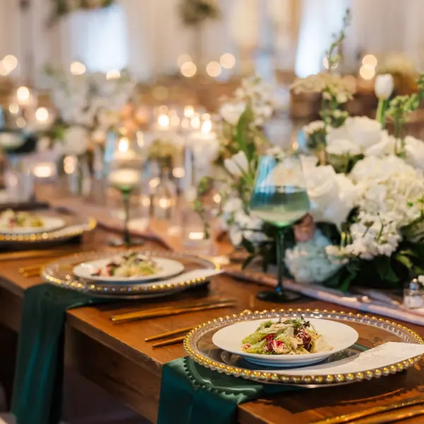 51Classic Emerald Green and Champagne Wedding Inspiration - Classic Emerald Green Downtown Tampa Wedding | Bob Buckhorn Center Romantic Riverfront Ballroom Wedding Reception | Gold Chiavari Chairs | Tall Gold Platform Centerpieces with White Hydrangeas, Roses, Wisteria Flower and Palm Greenery Arrangement Ideas | Clear Chargers with Gold Scalloped Edges and Emerald Green Napkins Tablescape Decor Inspiration | Tampa Bay Planner Wilder Mind Events | Florida Elite Events Catering | Venue Tampa River Center