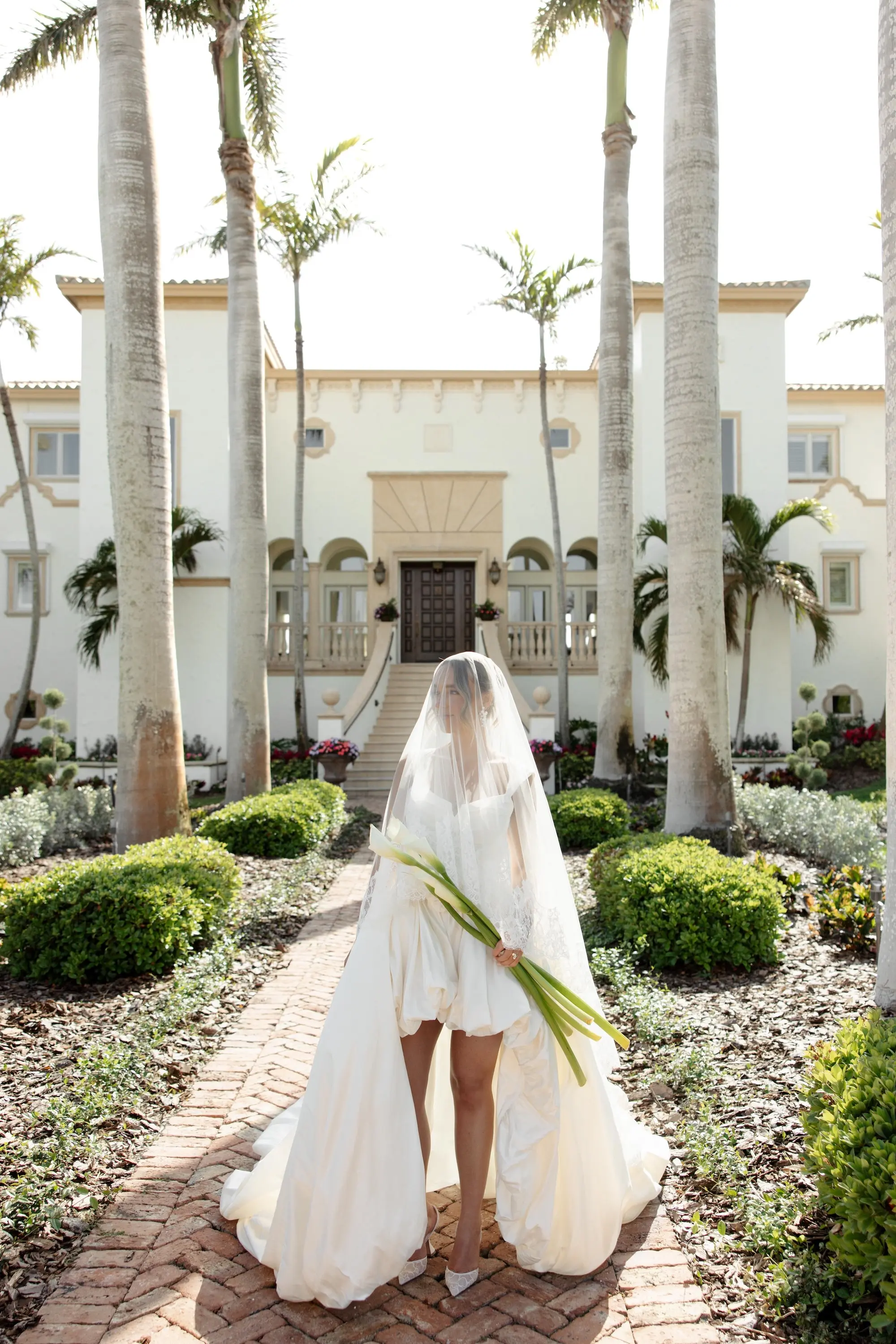 7Elegant Cream Vintage Wedding Inspiration - Luxurious, Neutral Downtown St. Pete Wedding | The Vinoy Elegant Ivory J Andreatta Wedding Dress Inspiration | Unique White Long-Stemmed Calla Lily Bridal Bouquet Ideas