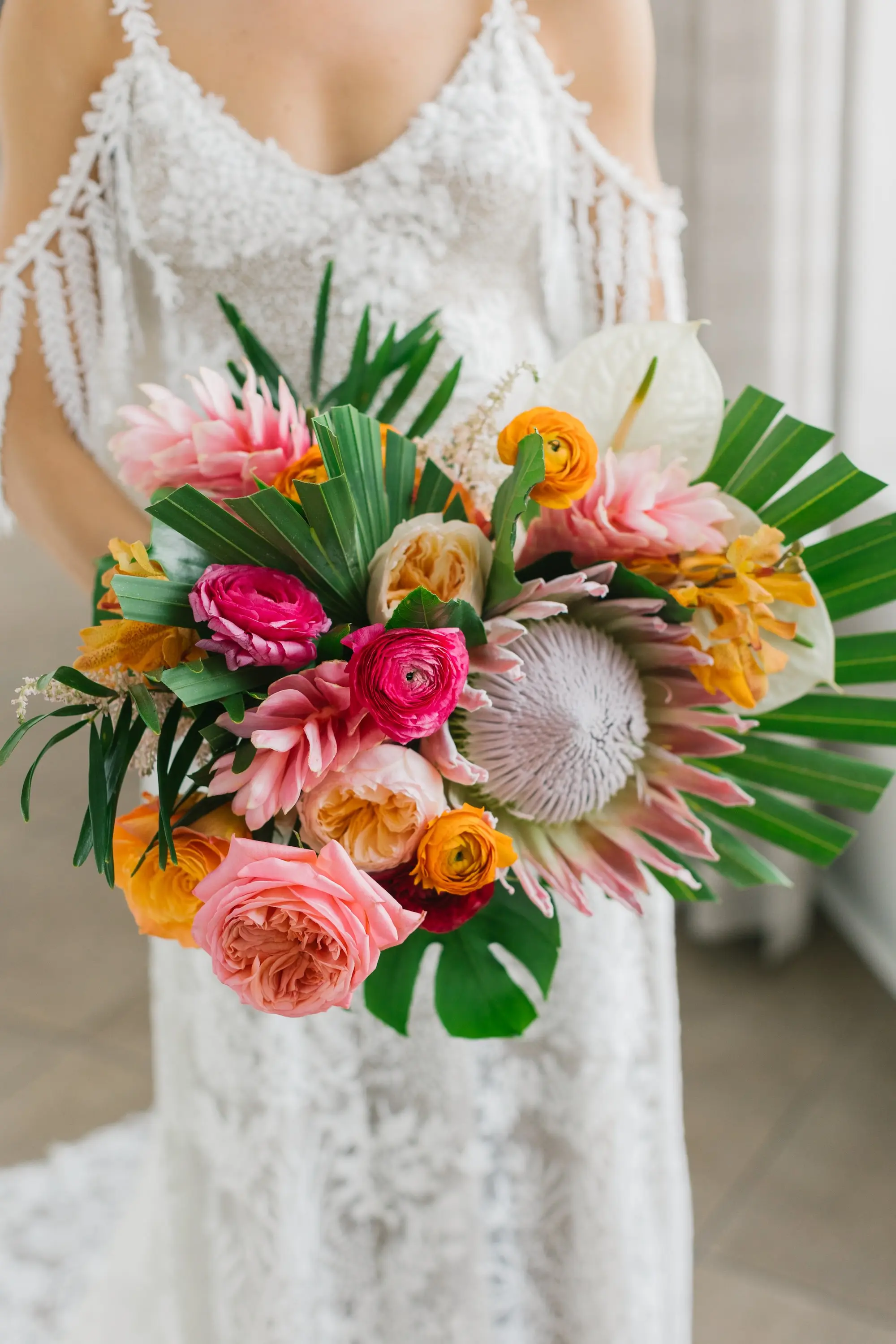 8Tropical Beach Boho Pink and Orange Wedding Inspiration - Vibrant, Tropical Boho St. Pete Beach Wedding | The Don CeSar Boho Tropical Pink, Orange, Red, White with Large Palm Fronds Floral Bridal Bouquet Ideas