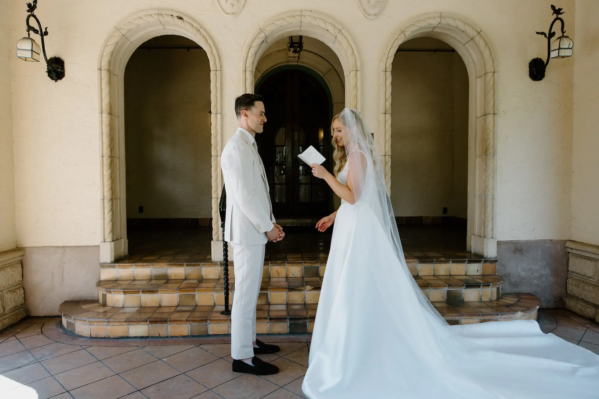 Bride and Groom First Look Wedding Portrait | White Pearl Corset Milla Nova Wedding Gown with Satin Skirt Inspiration | Monochromatic White Roses Bridal Bouquet Ideas | Hollywood Glam Curled Waves Wedding Bridal Hair Inspiration | Natural Glam Makeup Ideas | Sarasota Florist Beneva Flowers | Tampa Bay Boutique Truly Forever Bridal | Sarasota Hair and Makeup Artist Femme Akoi Beauty Studio | Content Creator Behind T