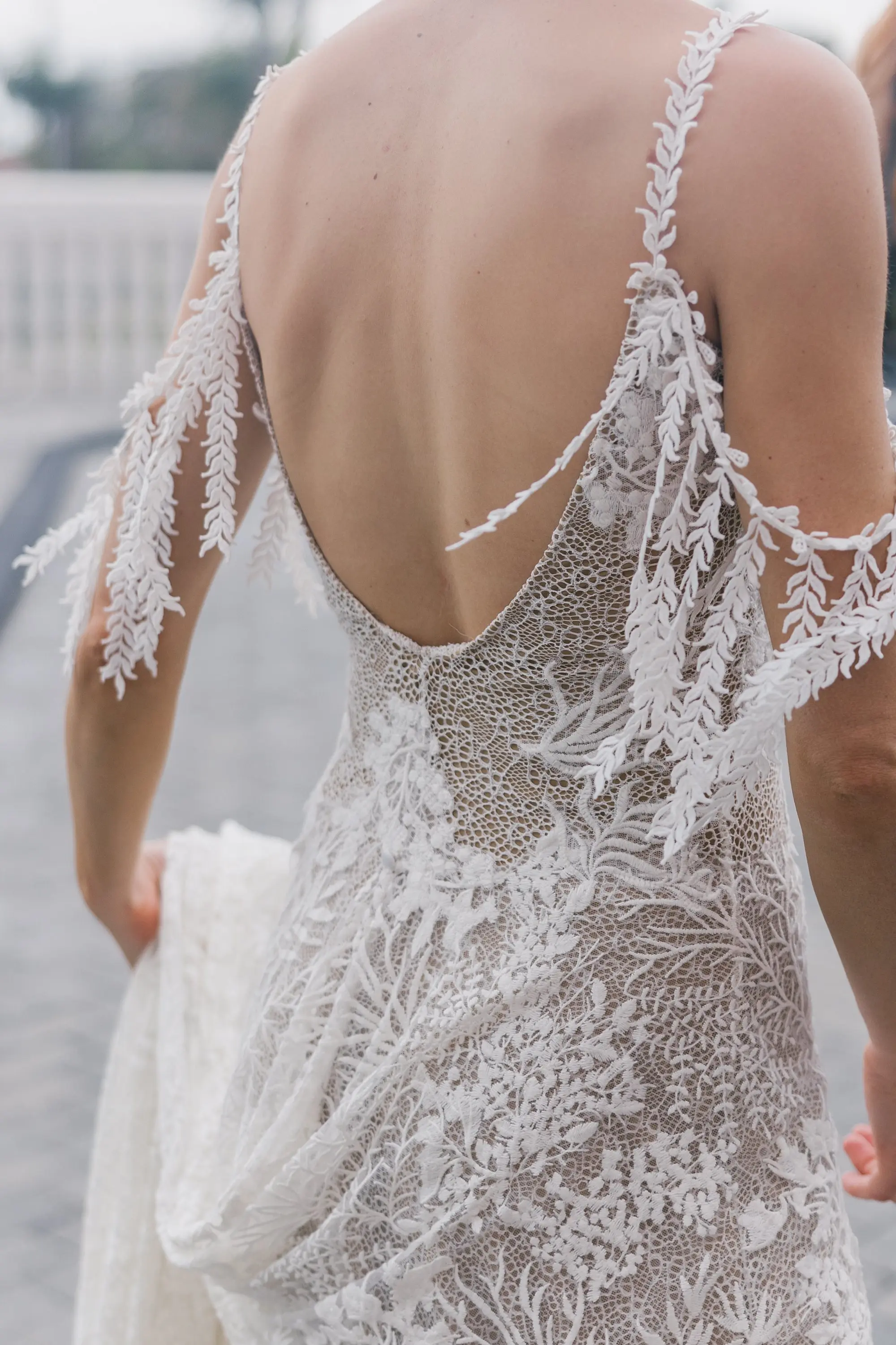 9Tropical Beach Boho Pink and Orange Wedding Inspiration - Vibrant, Tropical Boho St. Pete Beach Wedding | The Don CeSar Boho Romantic Bohemian Grace Loves Lace Wedding Gown with Detailed Floral Lace and Off-the-Shoulder Tasseled Armbands Inspiration