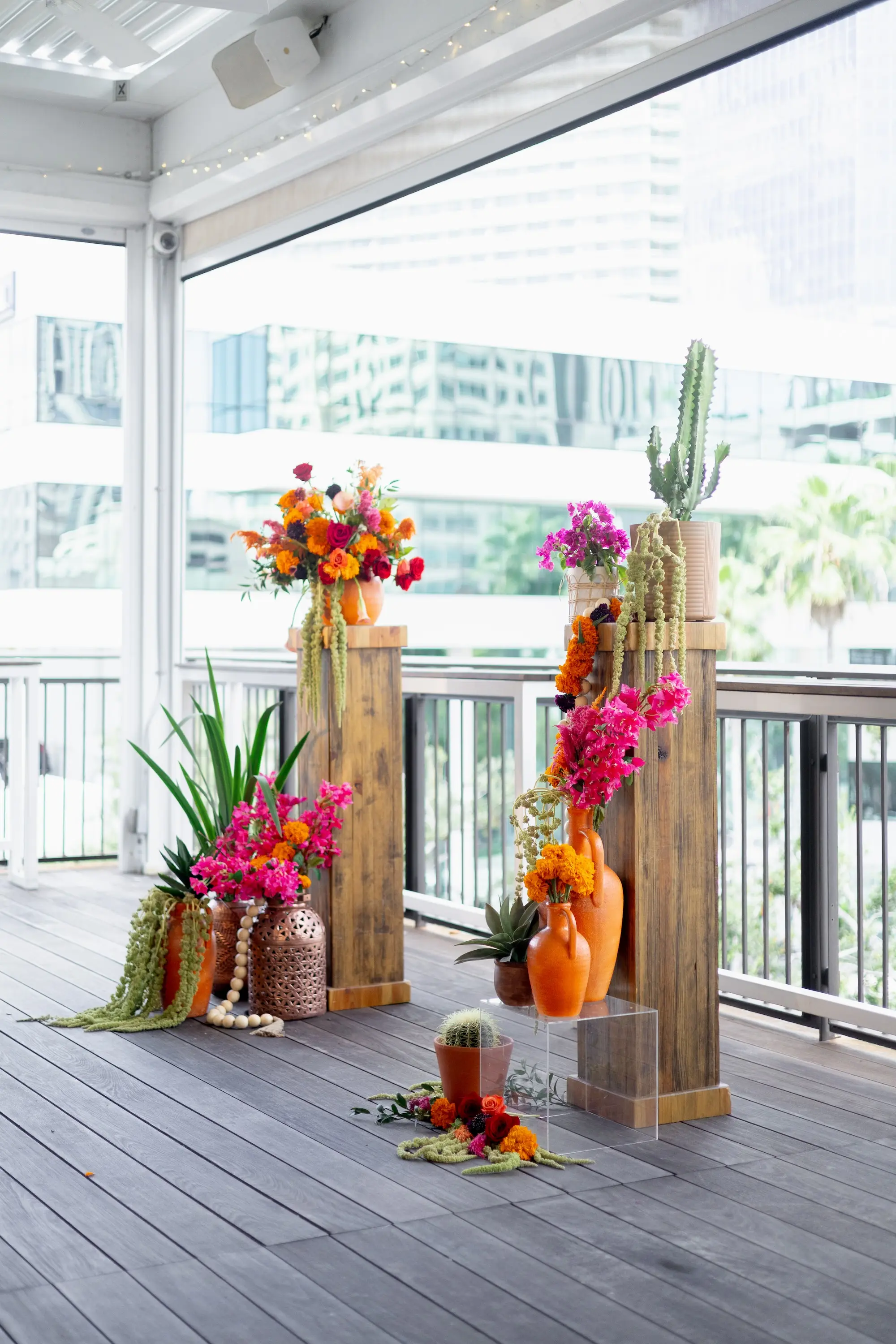 10Vibrant Southwestern Terracotta Pink and Orange Wedding Ideas - Vibrant, Rooftop Wedding Inspiration Shoot | Red Mesa Events Vibrant Southwest Mexican Wedding Reception Ideas | Bright Pink Orchids and Orange Marigolds Floral Arrangements with Lush Green Succulents and Cacti Greenery Arrangement Reception Decoration Inspiration | Terracotta Pots Decor Ideas | Tampa Bay Florist Save The Date Florida | St Pete Event Planner Coastal Coordinating