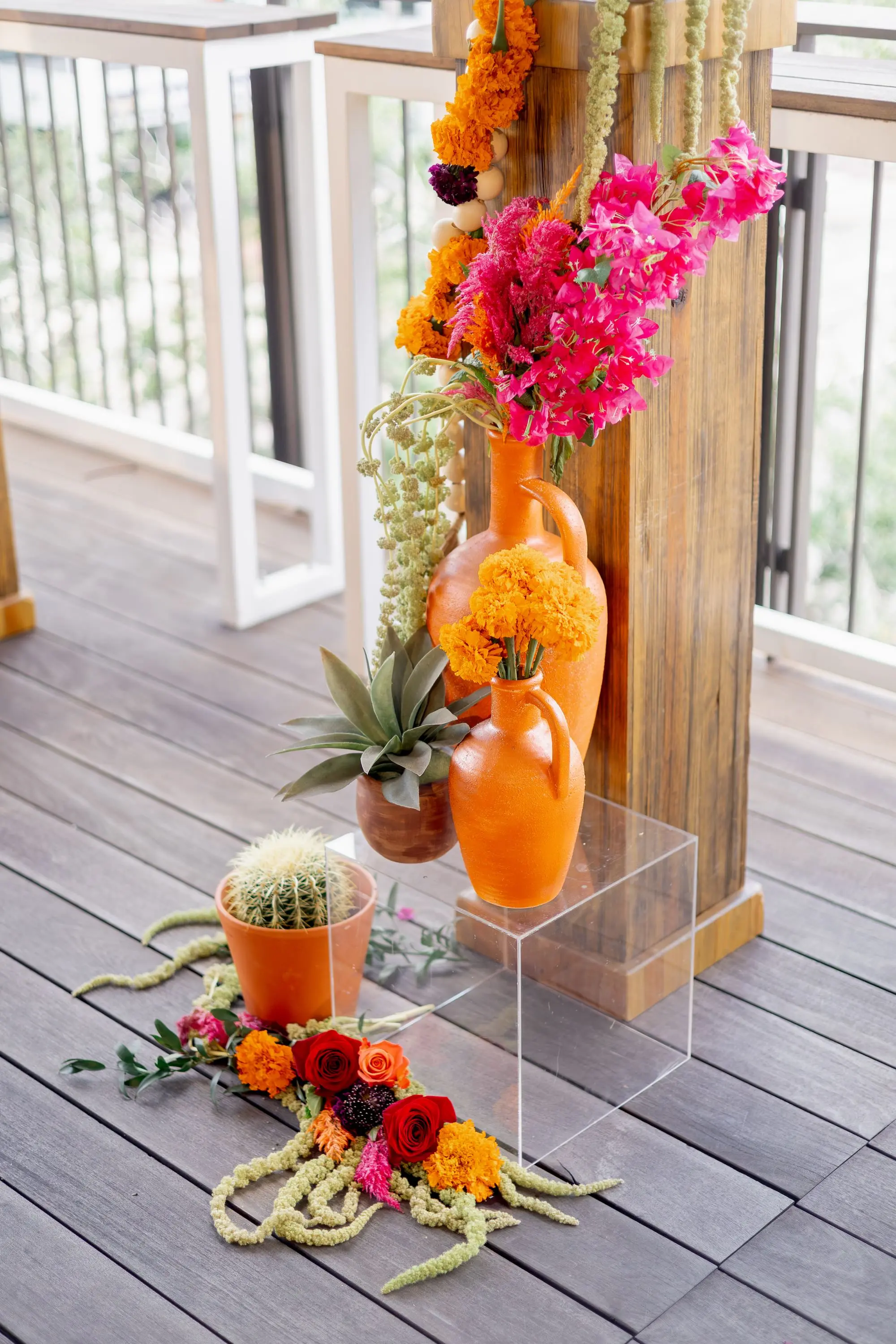 12Vibrant Southwestern Terracotta Pink and Orange Wedding Ideas - Vibrant, Rooftop Wedding Inspiration Shoot | Red Mesa Events Vibrant Southwest Mexican Wedding Reception Ideas | Bright Pink Orchids and Orange Marigolds Floral Arrangements with Lush Green Succulents and Cacti Greenery Arrangement Reception Decoration Inspiration | Terracotta Pots Decor Ideas | Tampa Bay Florist Save The Date Florida | St Pete Event Planner Coastal Coordinating