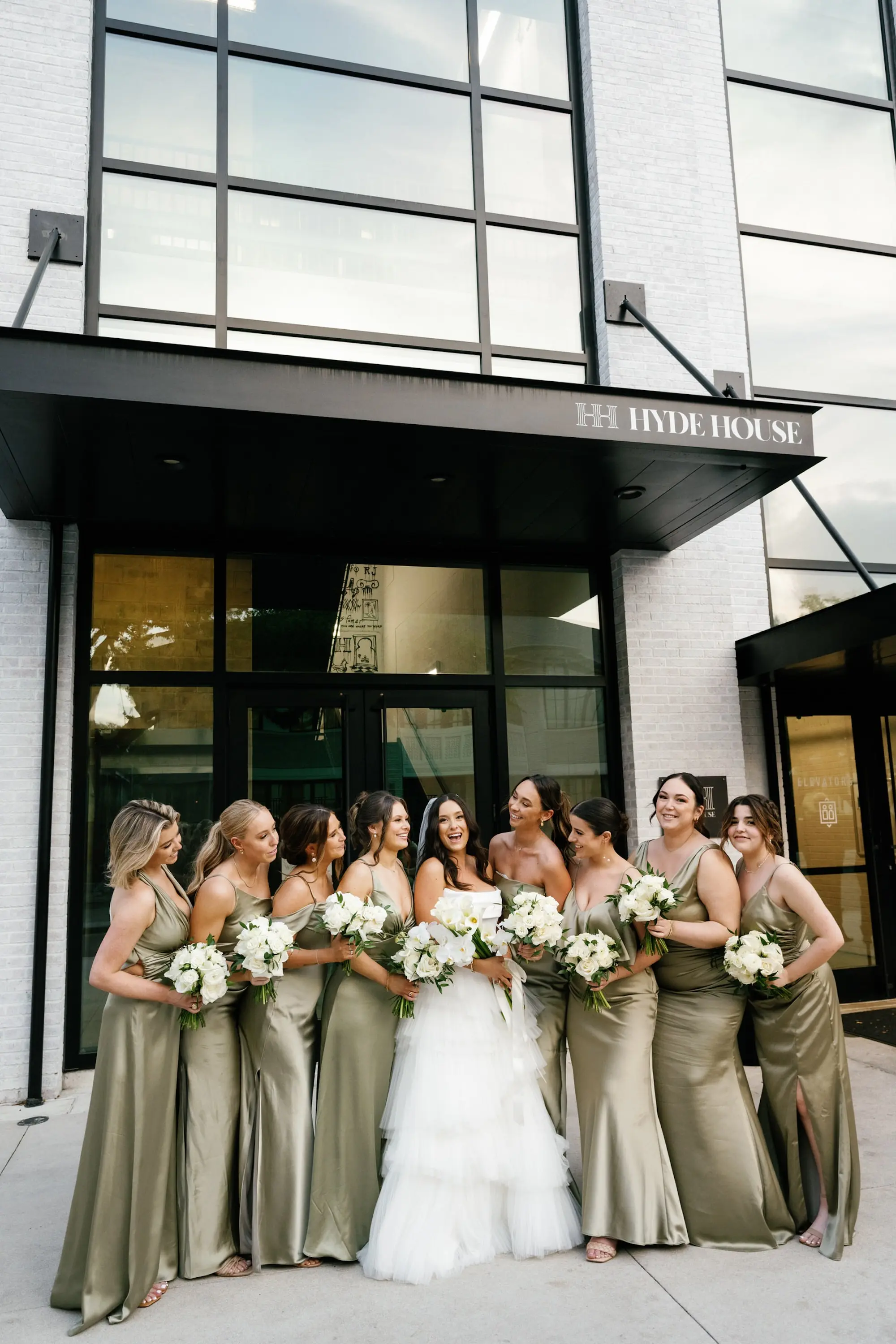 17Modern Classic Black and White Wedding Inspiration - Modern, Black and White Tampa Wedding | Hyde House Public Studio Bride and Bridesmaids Wedding Portrait | Mismatched Green Satin Bridesmaids Dress Ideas