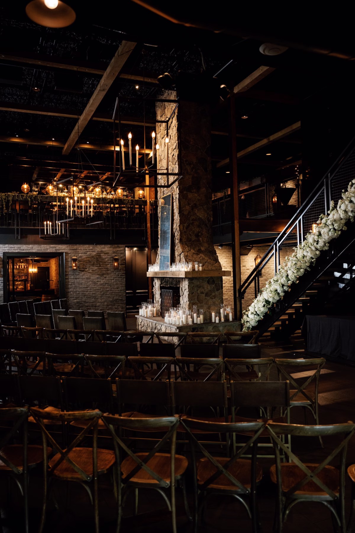 18Dark Black and Moody Candlelight Wedding Inpsiration St Venue Urban StillHouse - Moody, Black St. Pete Wedding | Urban Stillhouse Dark, Moody Industrial Wedding Ceremony Decor Inspiration | Romantic Candle Ceremony Decor Ideas | Romantic Monochromatic White Flower Garland Wedding Reception Decor Inspiration | White Roses, Hydrangeas Floral Installation Ideas | St. Petersburg Florida Wedding Reception Venue Urban Stillhouse