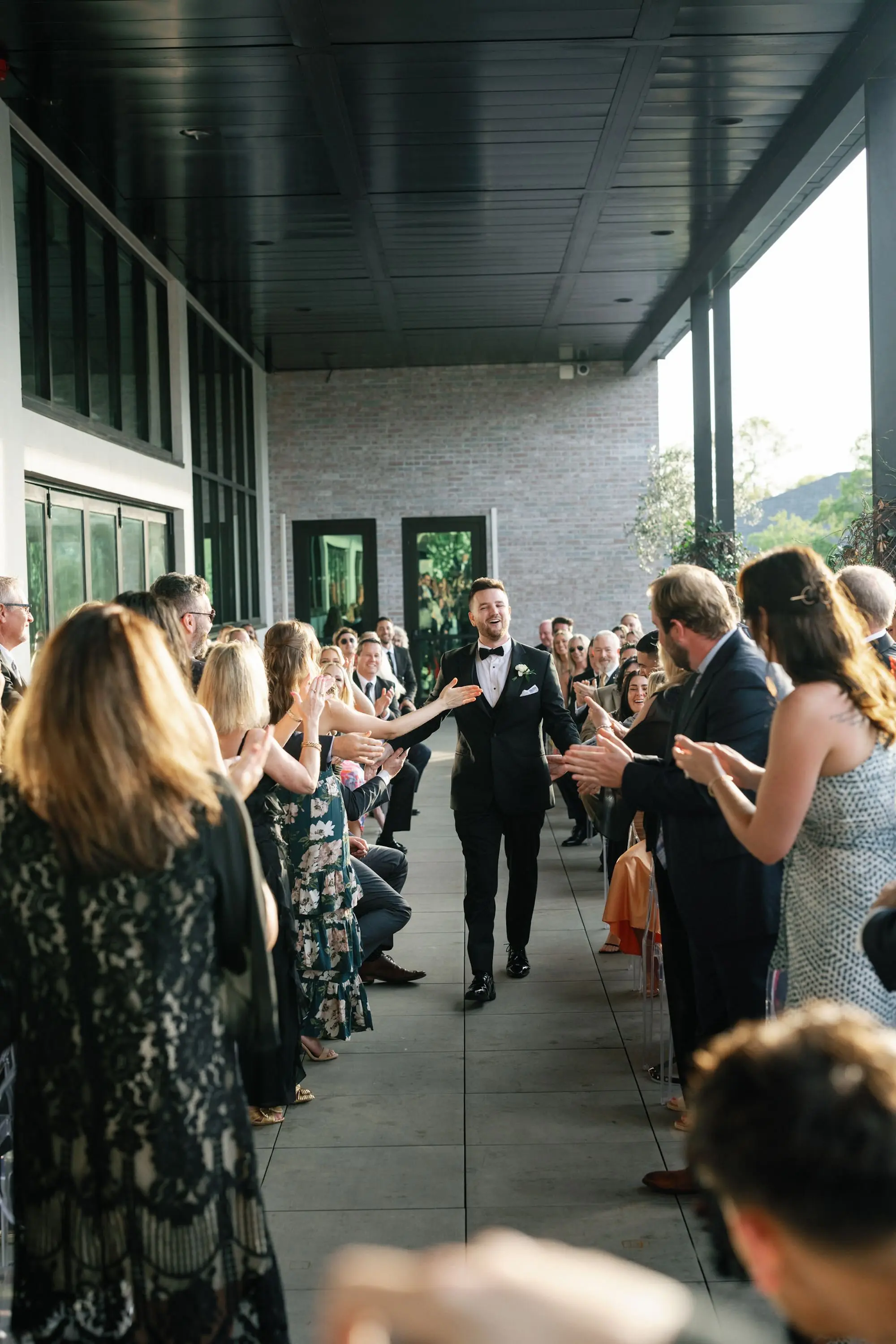 23Modern Classic Black and White Wedding Inspiration - Modern, Black and White Tampa Wedding | Hyde House Public Studio Groom Walking Down Wedding Aisle