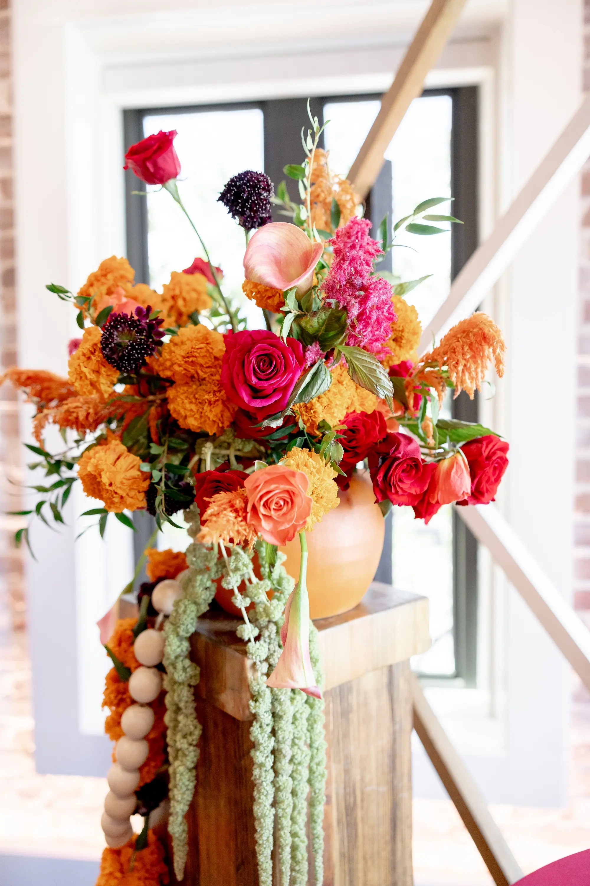30Vibrant Southwestern Terracotta Pink and Orange Wedding Ideas - Vibrant, Rooftop Wedding Inspiration Shoot | Red Mesa Events Vibrant Pink, Orange, Rust Red, Floral Arrangements Centerpiece Arrangements in Terracotta Pots Reception Decoration Inspiration | Tampa Bay Florist Save The Date Florida