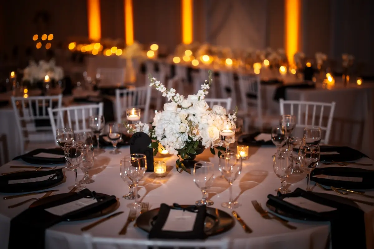 32Modern Black and White Wedding Inspiration - Timeless Black and White Downtown Tampa Wedding | The Vault Luxurious Black and White Ballroom Wedding Reception | White Chiavari Chairs | Monochromatic White Florals, Roses, Orchids, Hydrangeas Centerpieces Ideas | Romantic Candlelight Tablescape on White Linens Inspiration | Black Napkins with Gold Flatware Decor Ideas | Tampa Bay Florist Save The Date Florida | Kate Ryan Event Rentals | Venue The Vault