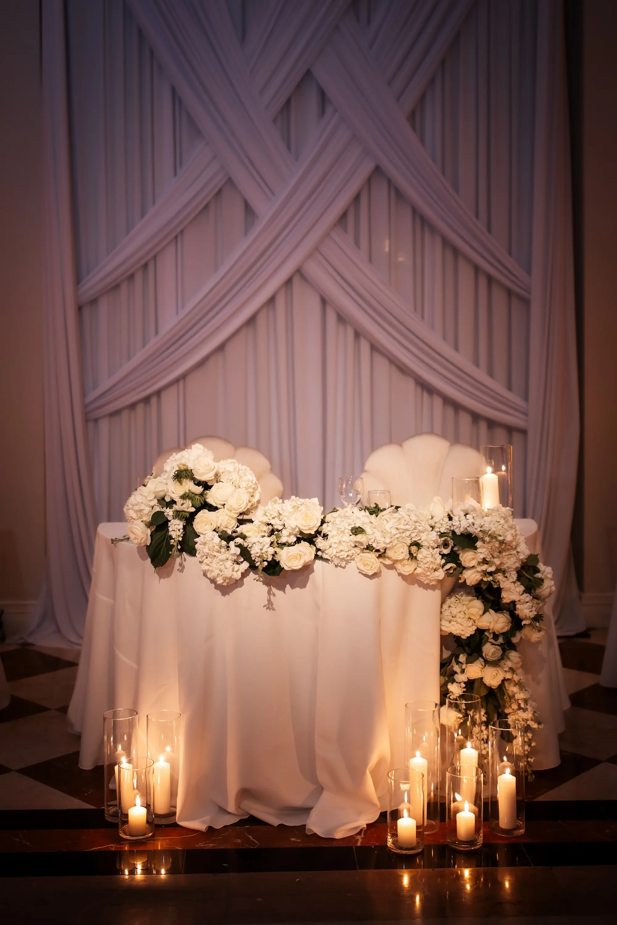 35Modern Black and White Wedding Inspiration - Timeless Black and White Downtown Tampa Wedding | The Vault Luxurious Monochromatic White Sweetheart Table Wedding Reception Decor Inspiration | White Roses and Hydrangeas with Greenery Garland Ideas | Romantic Candlelight Decor Inspiration | Tampa Bay Florist Save The Date Florida | Kate Ryan Event Rentals | Venue The Vault