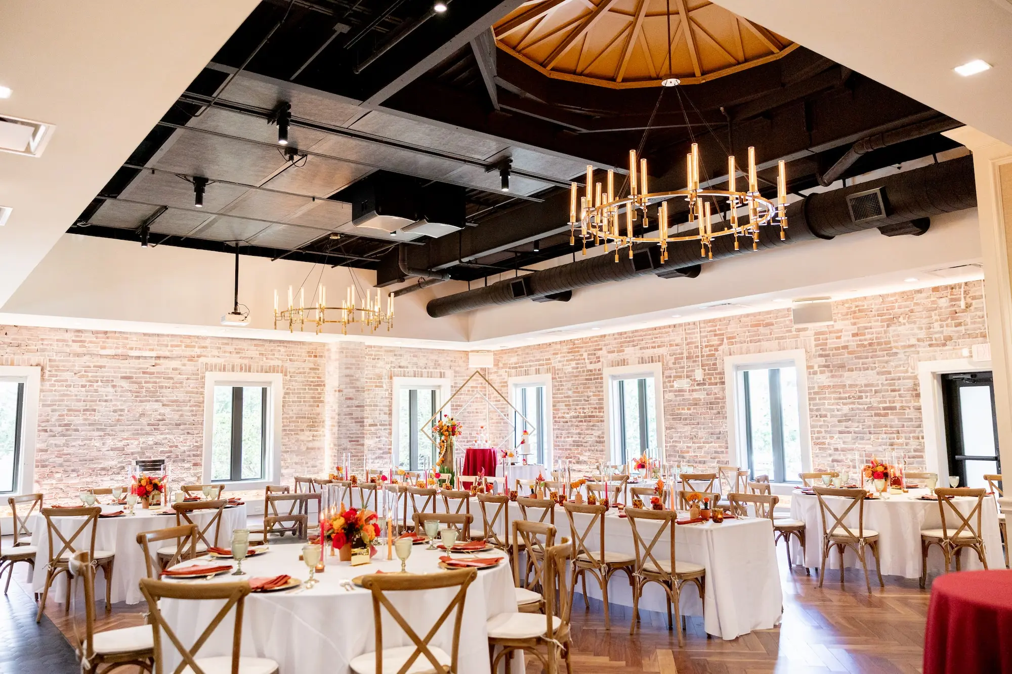 37Vibrant Southwestern Terracotta Pink and Orange Wedding Ideas St Pete Venue Red Mesa Events - Vibrant, Rooftop Wedding Inspiration Shoot | Red Mesa Events Southwestern Ballroom Wedding Reception | Rustic Wooden Chairs | Vibrant Southwest Mexican Wedding Reception Ideas | Bright Pink, Orange, Rust Red, Floral Arrangements Centerpiece Arrangements in Terracotta Pots Reception Decoration Inspiration | Romantic Candlelight Tablescape Ideas | Red Menus on White Linens Inspiration | Tampa Bay Florist Save The Date Florida | St Pete Event Planner Coastal Coordinating | Downtown St Pete Event Venue Red Mesa Events | St Pete Rentals Gabro Event Services